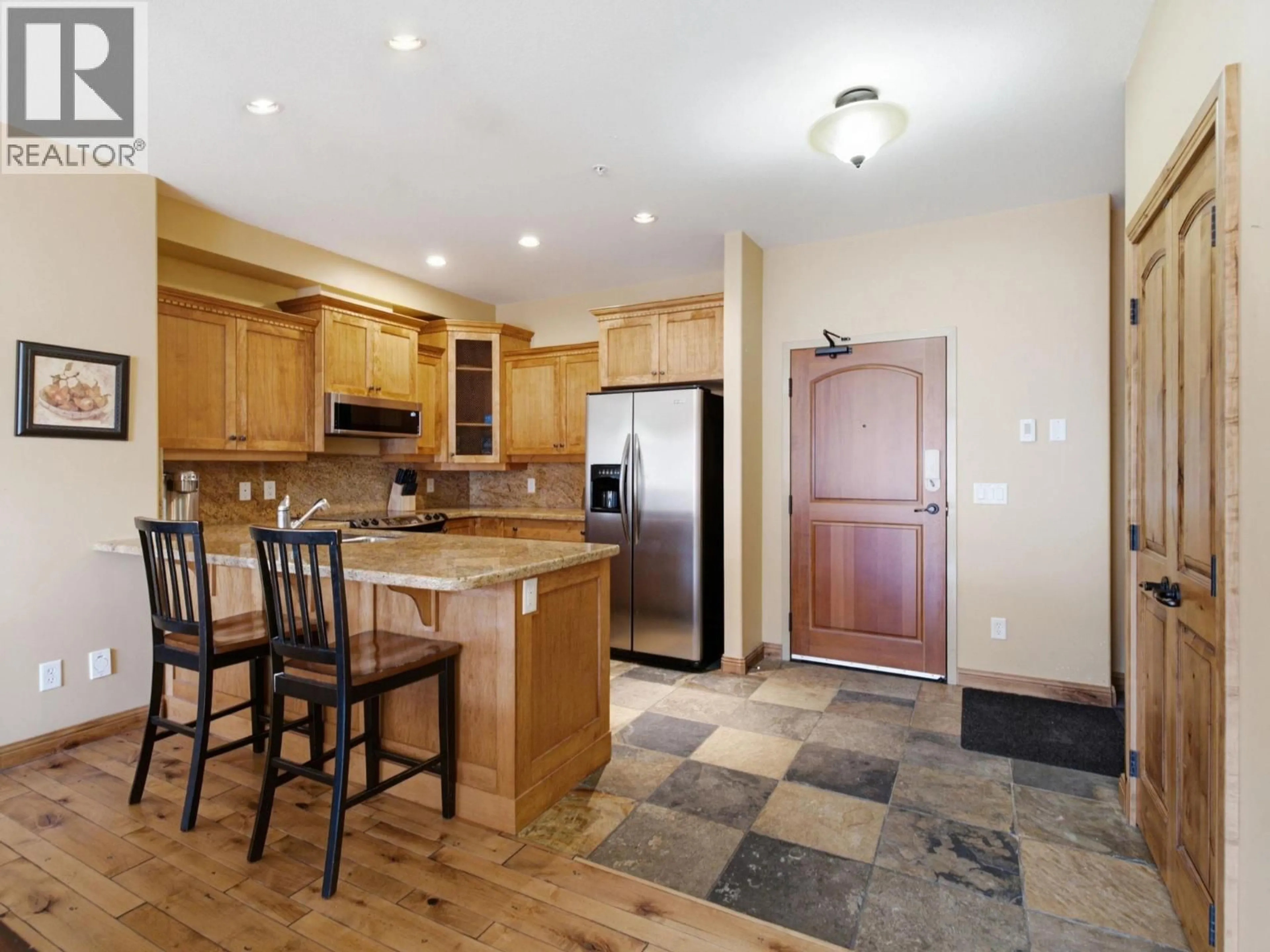 Open concept kitchen, ceramic/tile floor for 309 - 7700 PORCUPINE ROAD, Big White British Columbia V1P1T4