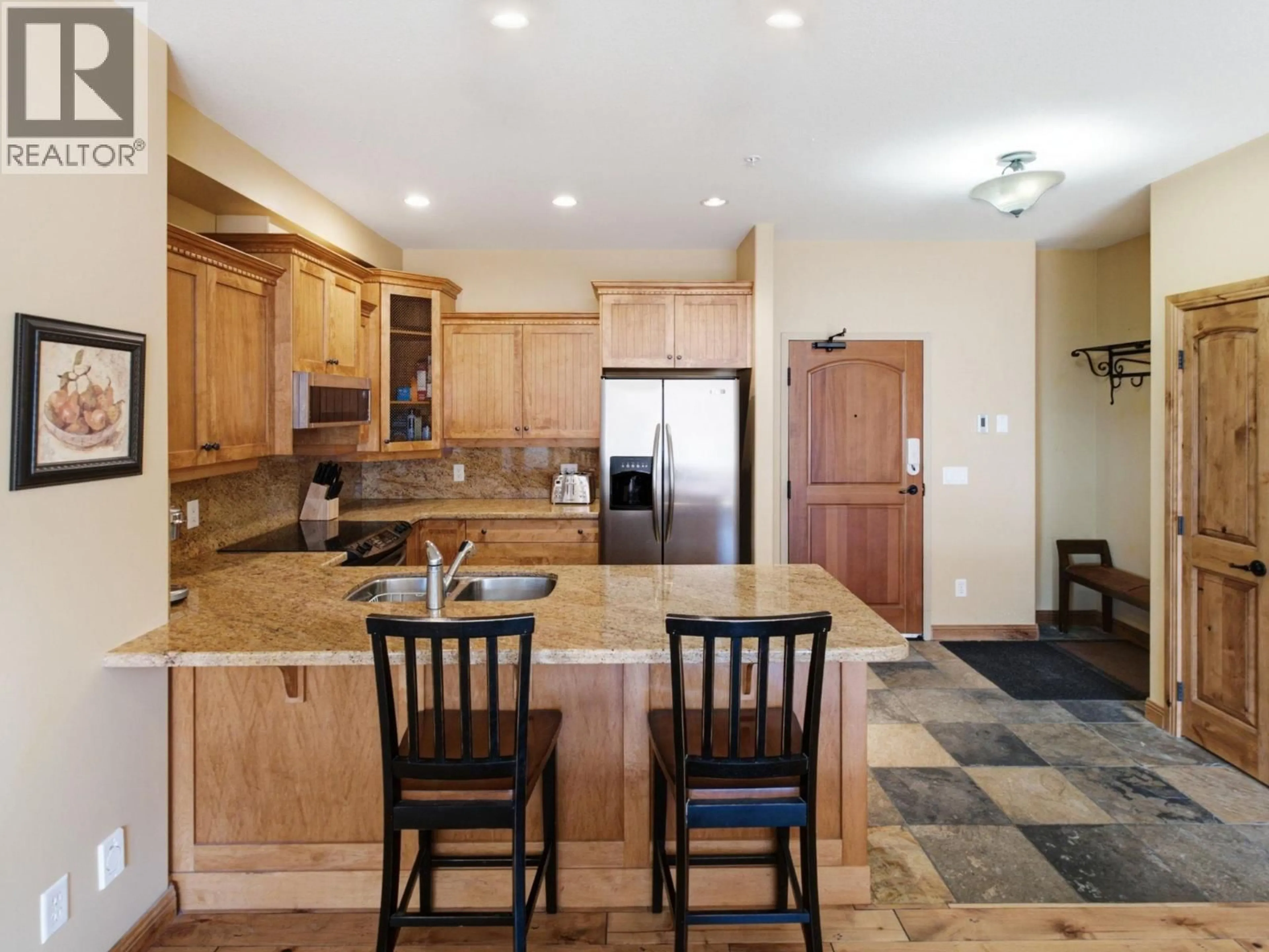 Open concept kitchen, ceramic/tile floor for 309 - 7700 PORCUPINE ROAD, Big White British Columbia V1P1T4