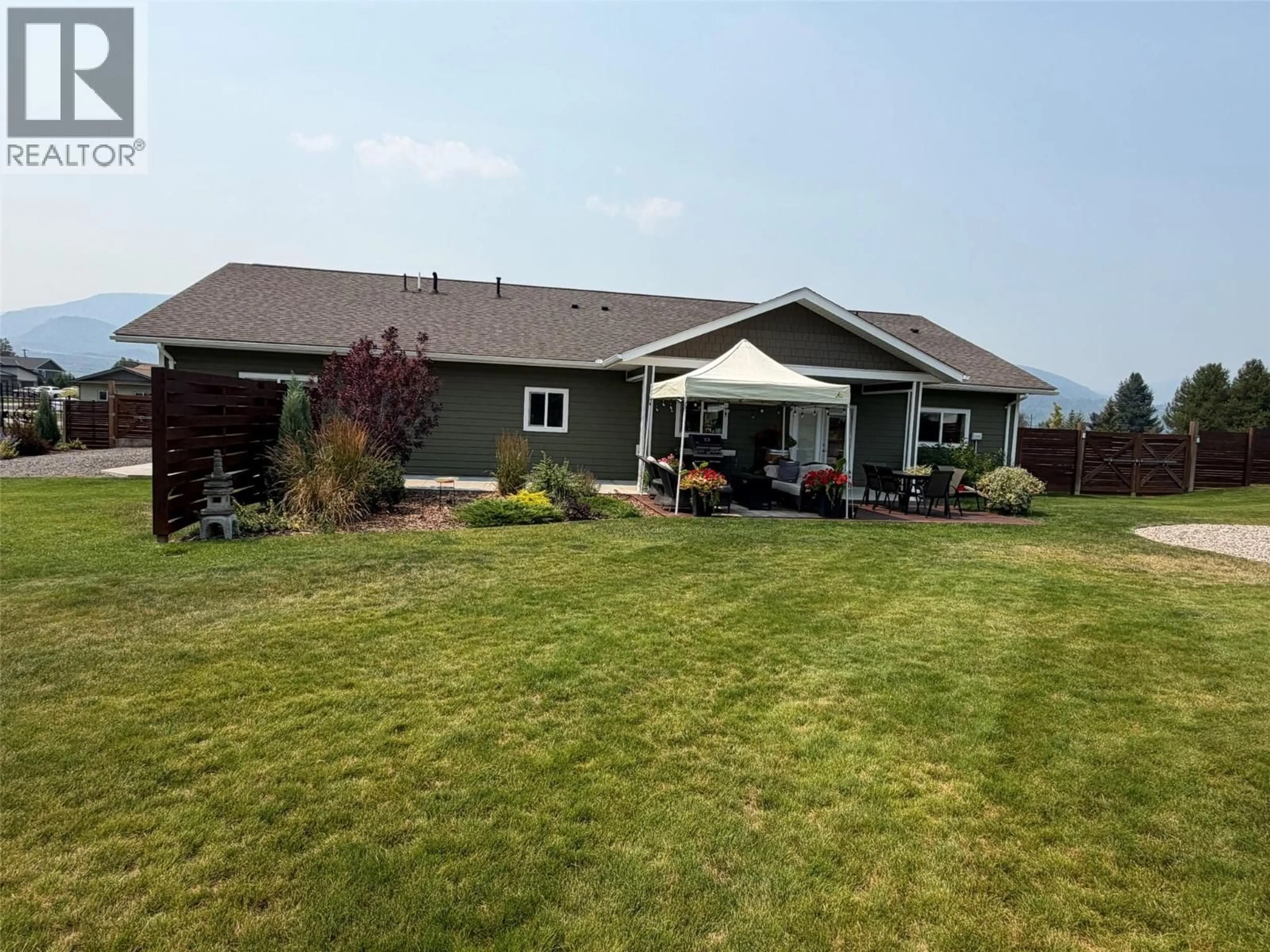 A pic from outside/outdoor area/front of a property/back of a property/a pic from drone, mountain view for 308 ELKVIEW TRAIL, Castlegar British Columbia V1N4L5