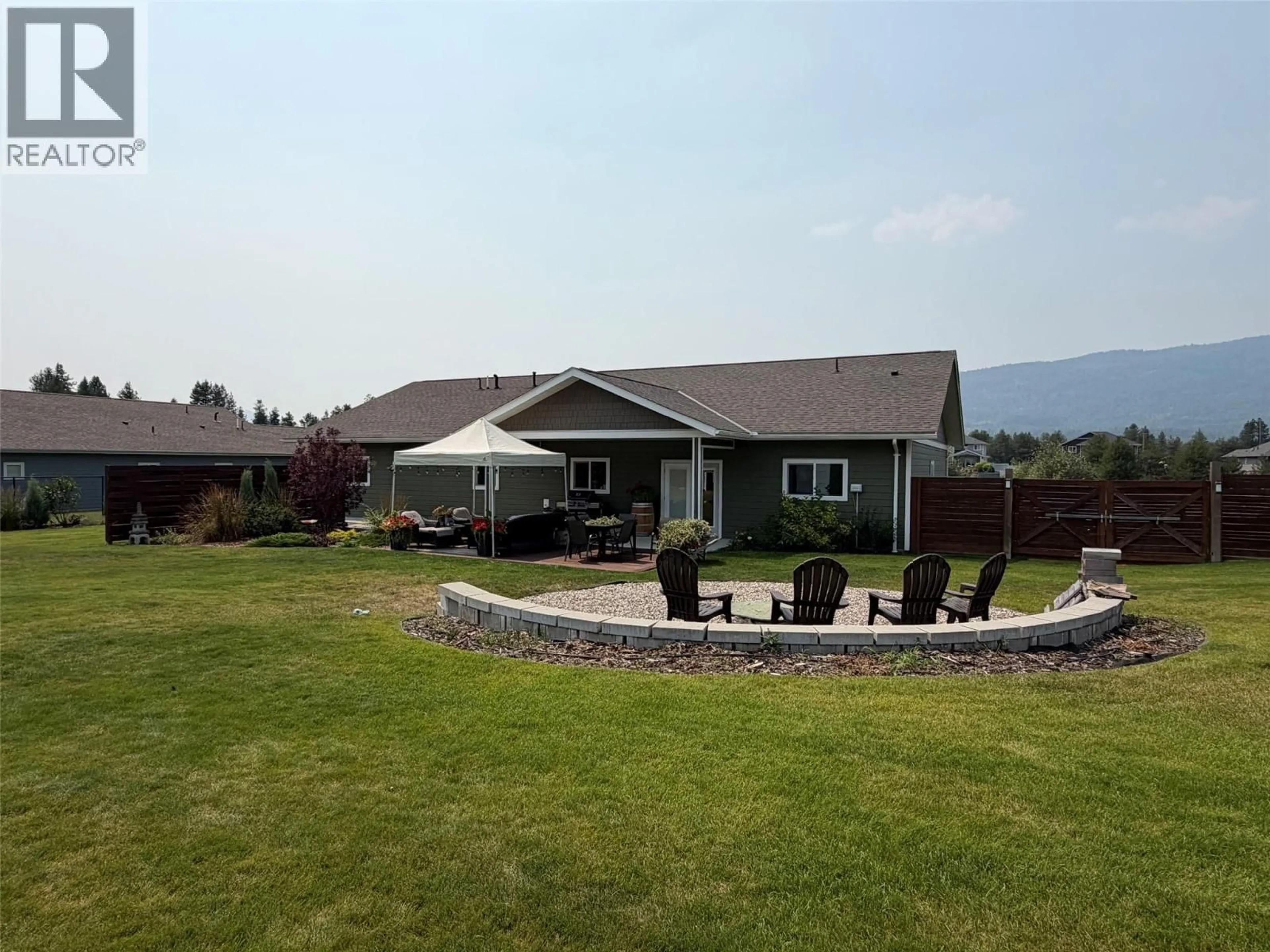 A pic from outside/outdoor area/front of a property/back of a property/a pic from drone, mountain view for 308 ELKVIEW TRAIL, Castlegar British Columbia V1N4L5