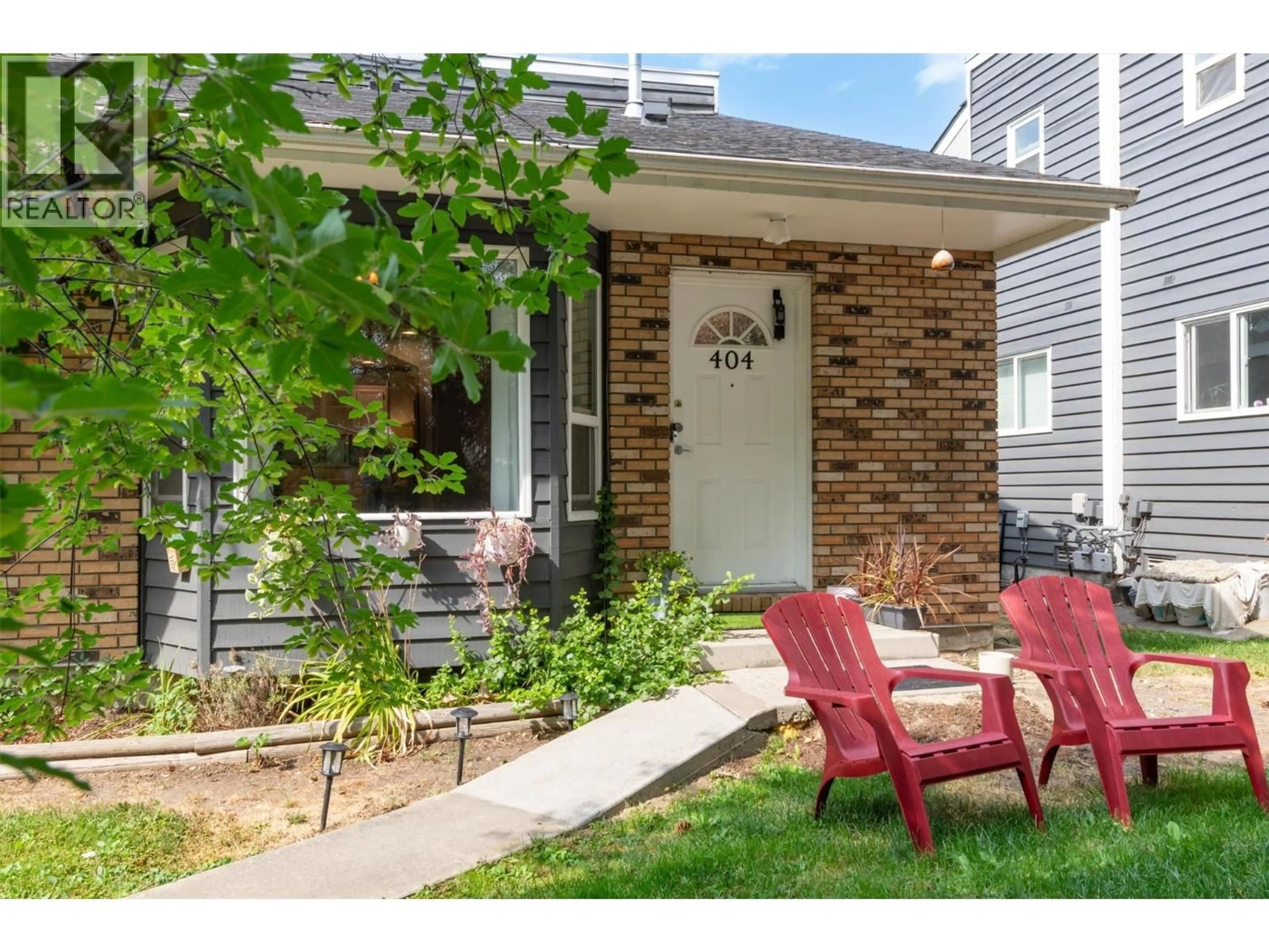 Home with brick exterior material, street for 404 - 3155 GORDON DRIVE, Kelowna British Columbia V1W3N6