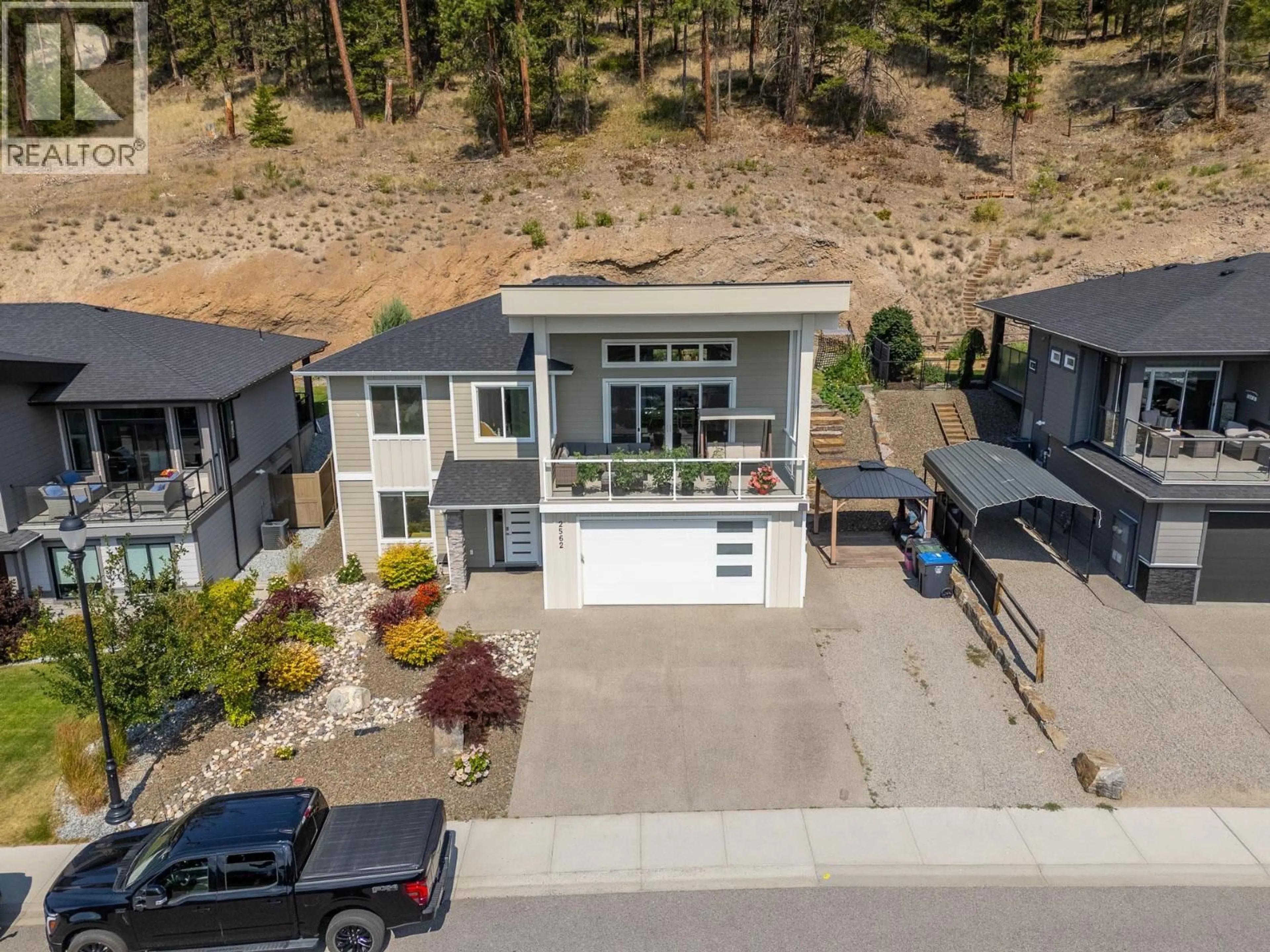 A pic from outside/outdoor area/front of a property/back of a property/a pic from drone, street for 2562 CROWN CREST DRIVE, West Kelowna British Columbia V4T3K4