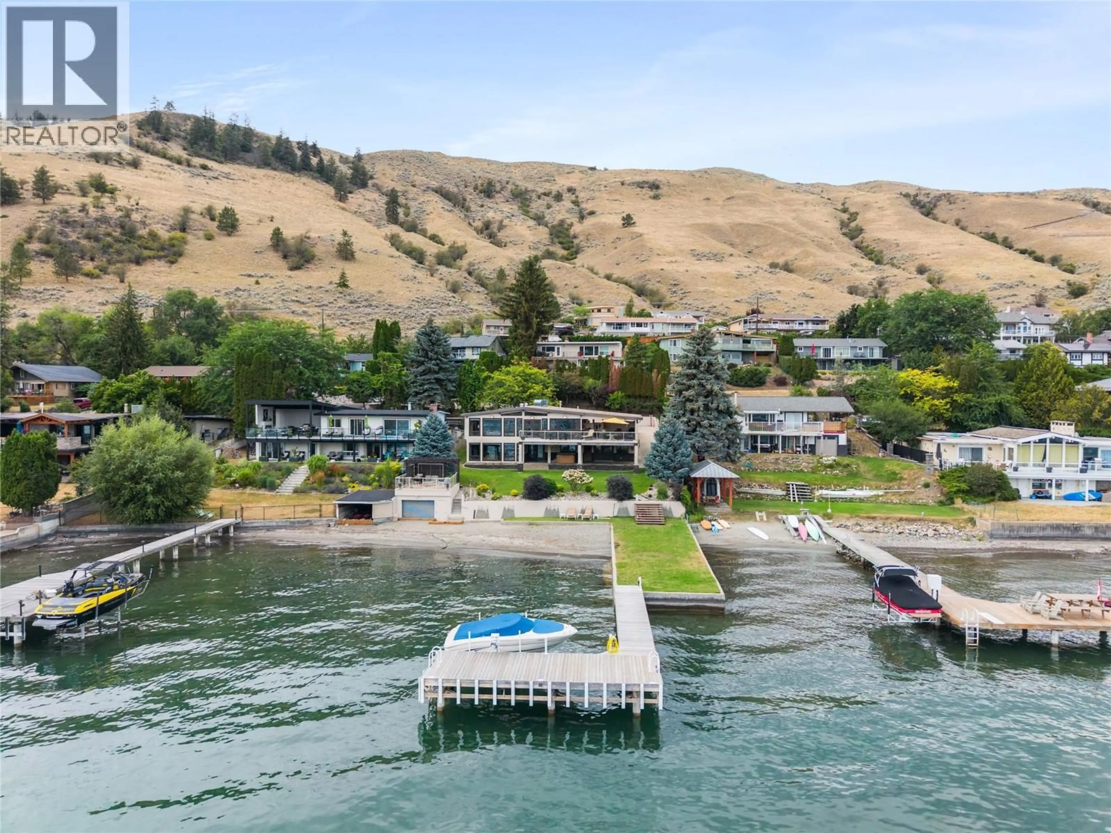 A pic from outside/outdoor area/front of a property/back of a property/a pic from drone, water/lake/river/ocean view for 8052 BEACHCOMBER BAY ROAD, Vernon British Columbia V1H1C7