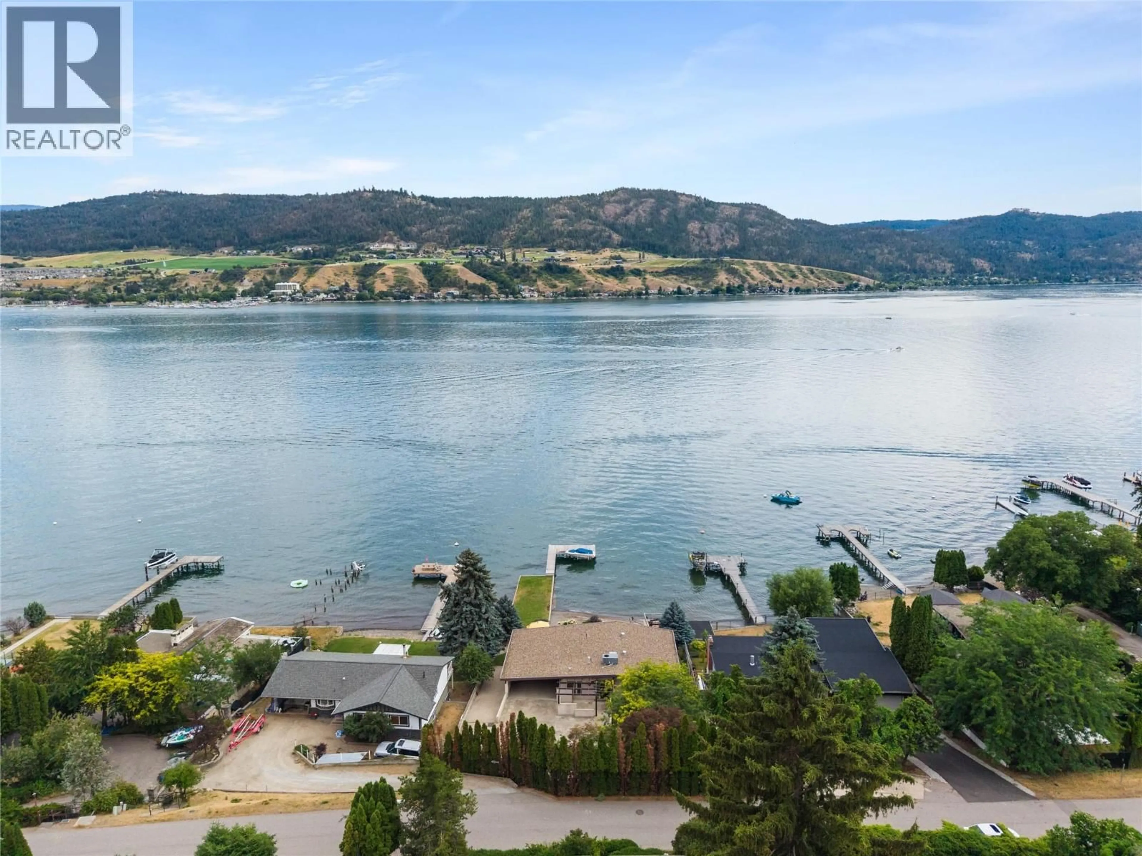 A pic from outside/outdoor area/front of a property/back of a property/a pic from drone, water/lake/river/ocean view for 8052 BEACHCOMBER BAY ROAD, Vernon British Columbia V1H1C7