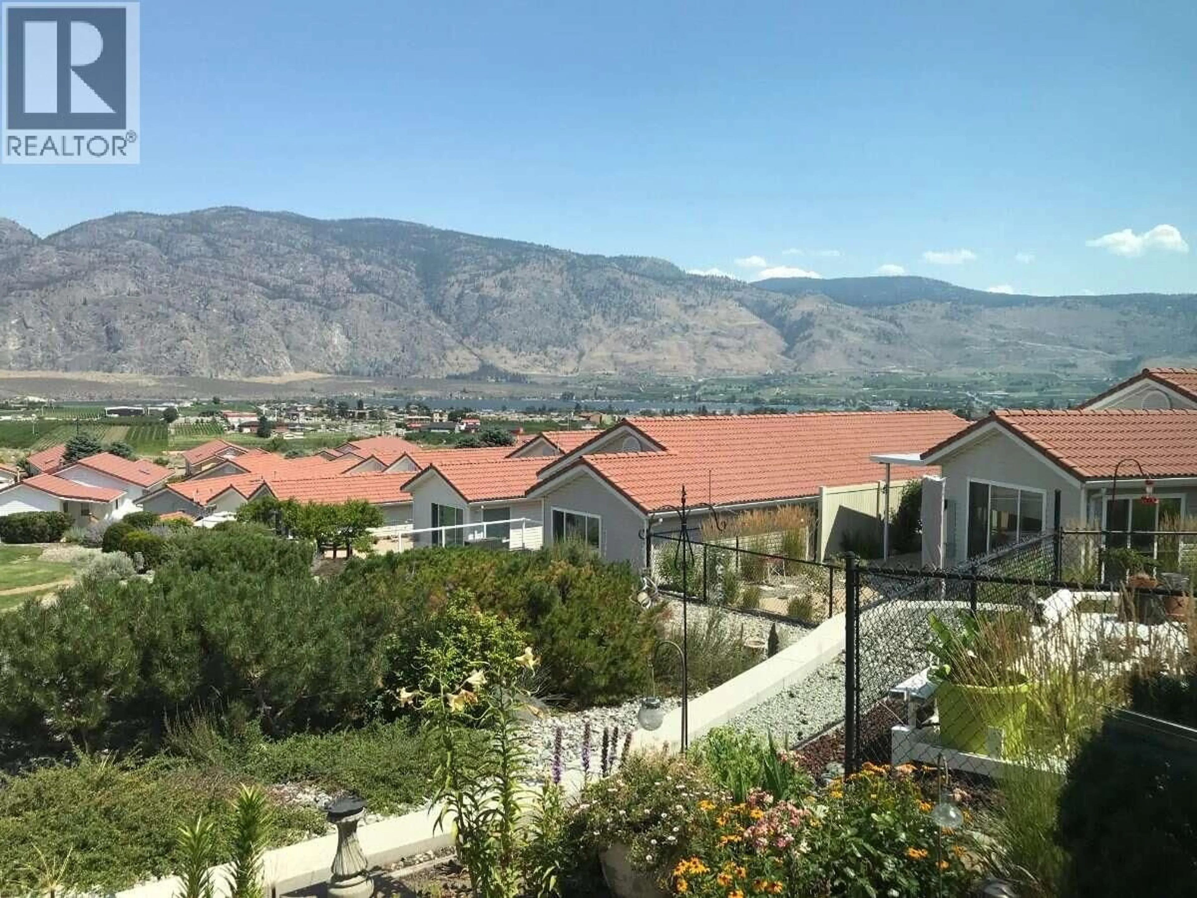 A pic from outside/outdoor area/front of a property/back of a property/a pic from drone, mountain view for 48 - 9400 115TH STREET, Osoyoos British Columbia V0H1V5