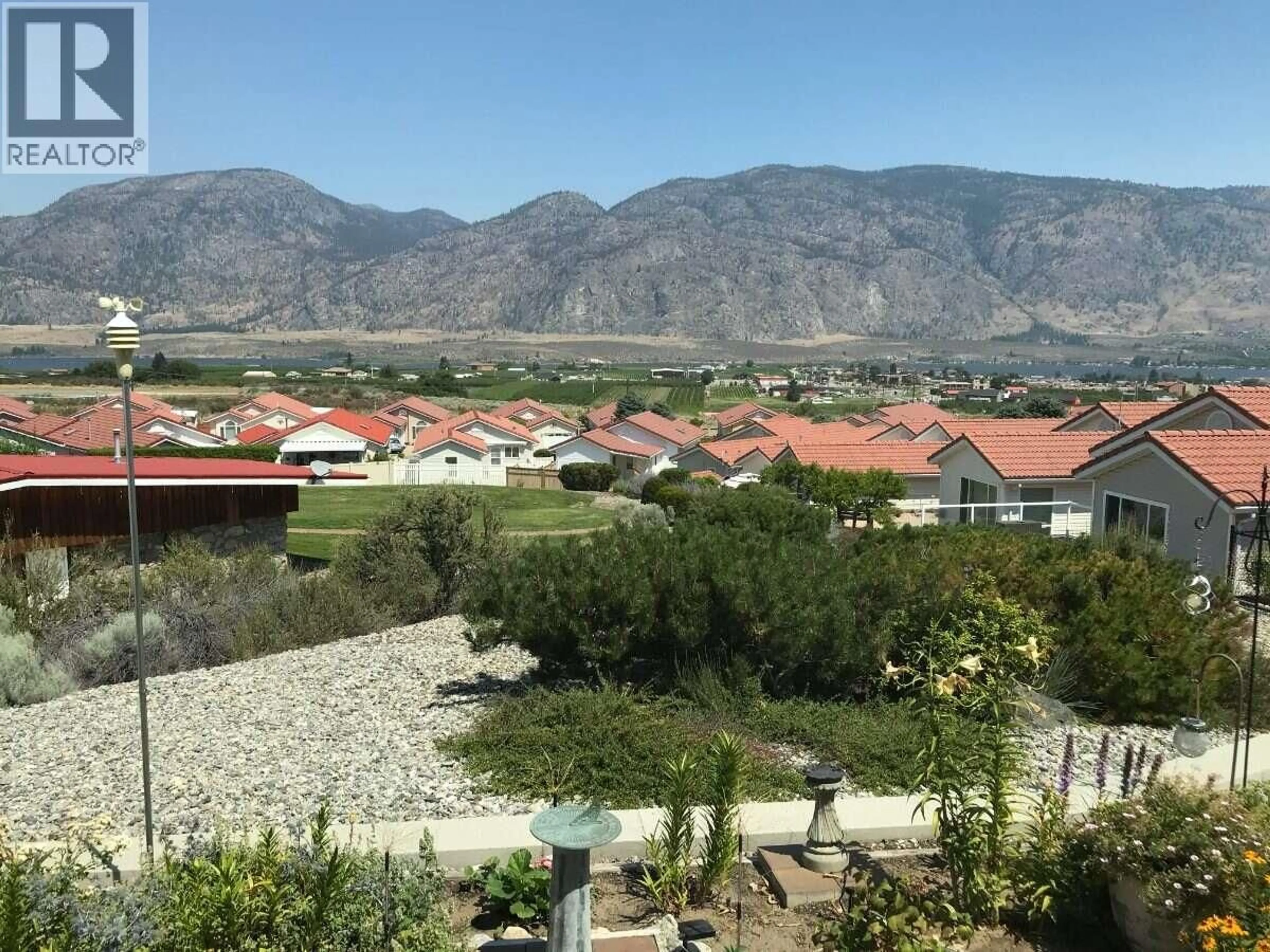 A pic from outside/outdoor area/front of a property/back of a property/a pic from drone, mountain view for 48 - 9400 115TH STREET, Osoyoos British Columbia V0H1V5