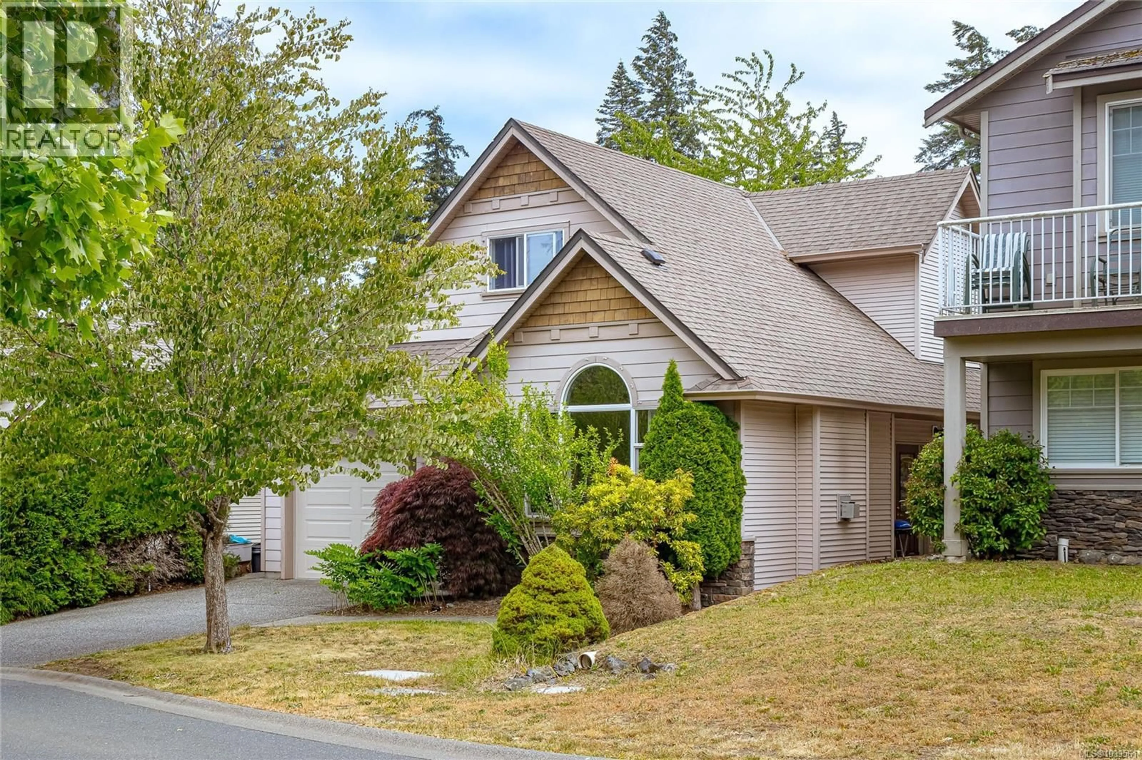 Home with vinyl exterior material, street for 1001 WILD RIDGE WAY, Langford British Columbia V9C4M8
