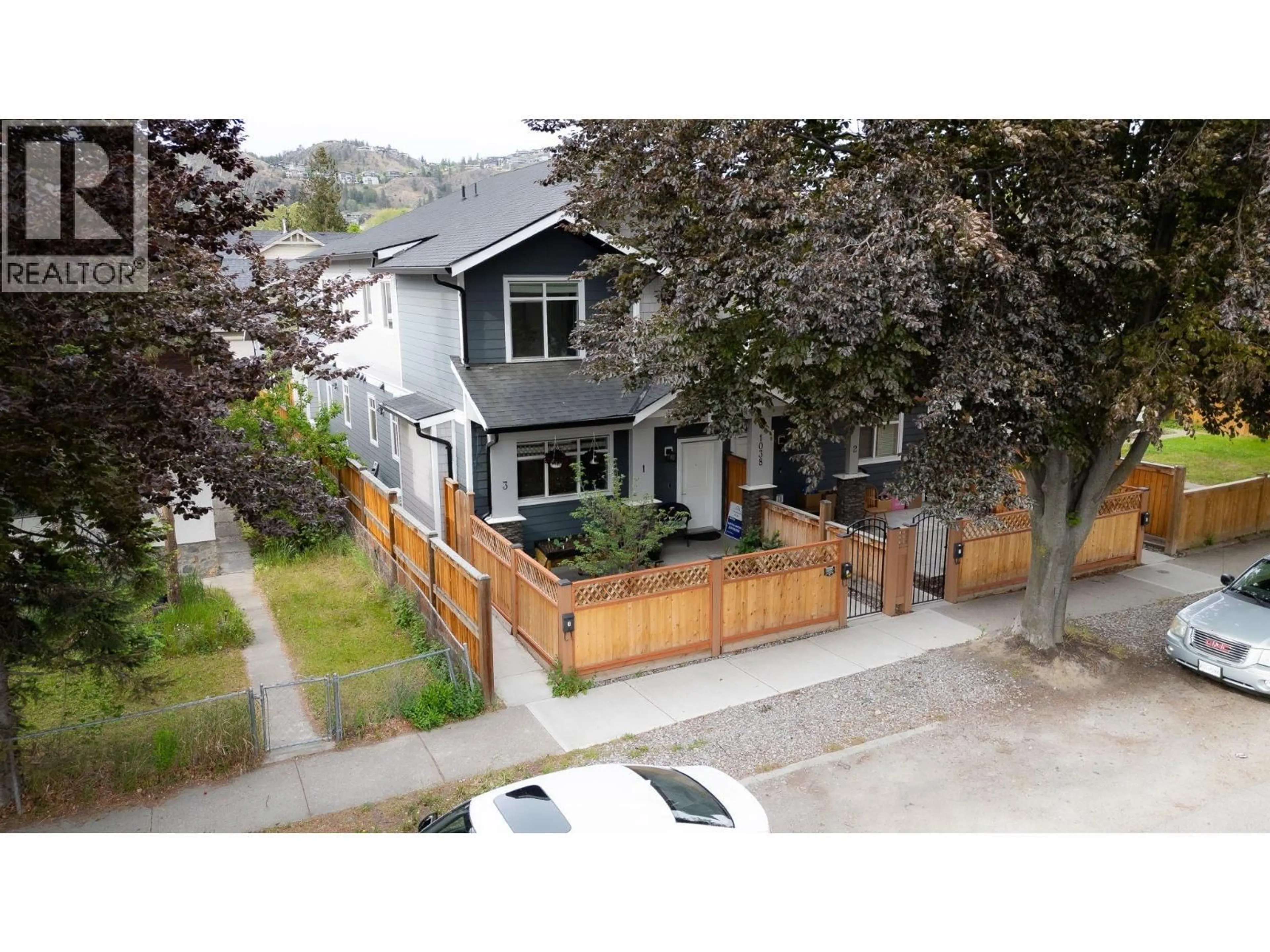 A pic from outside/outdoor area/front of a property/back of a property/a pic from drone, street for 1 - 1038 STOCKWELL AVENUE, Kelowna British Columbia V1Y6W5