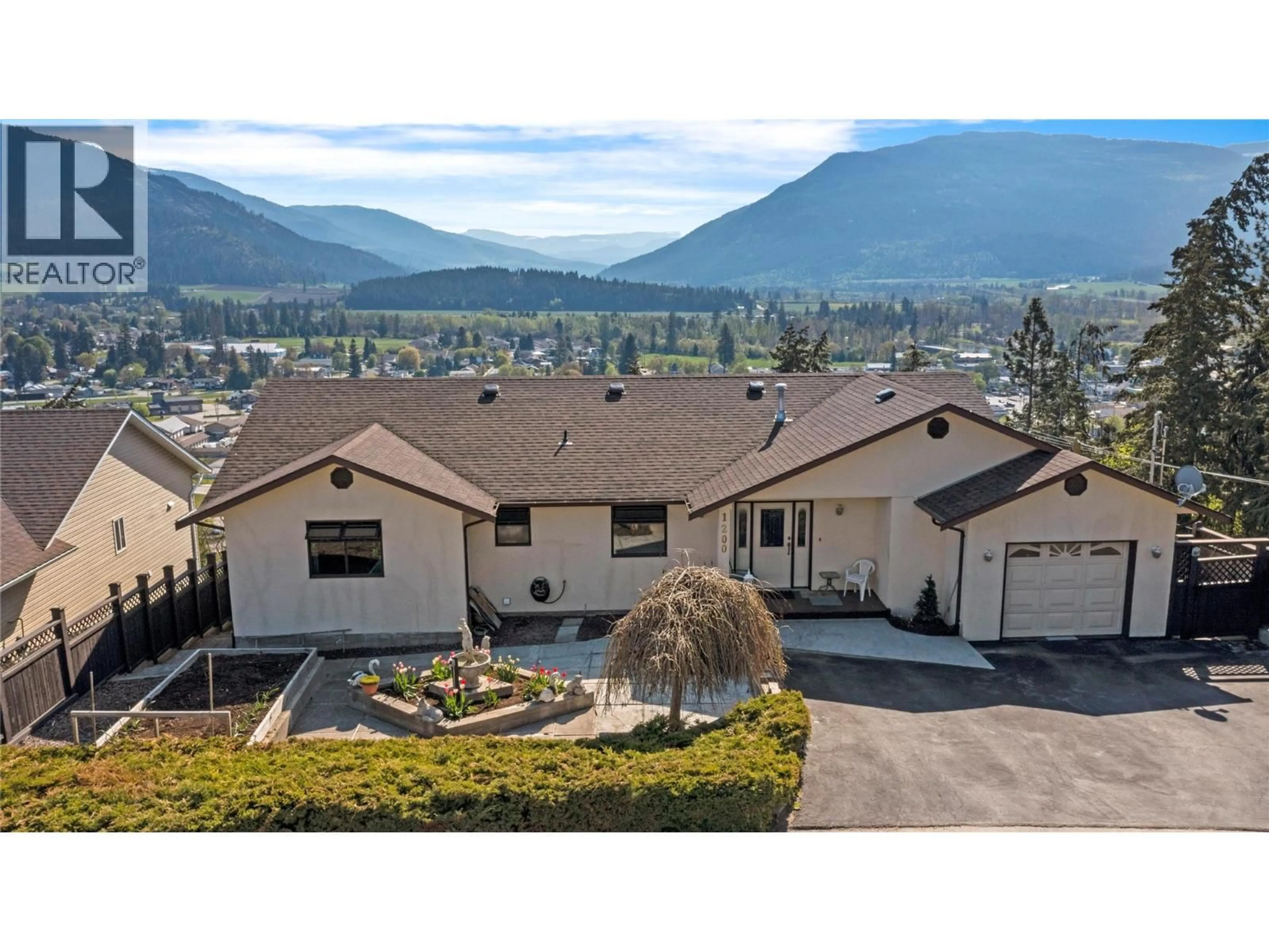 A pic from outside/outdoor area/front of a property/back of a property/a pic from drone, mountain view for 1200 LAWES STREET, Enderby British Columbia V4Y4B7