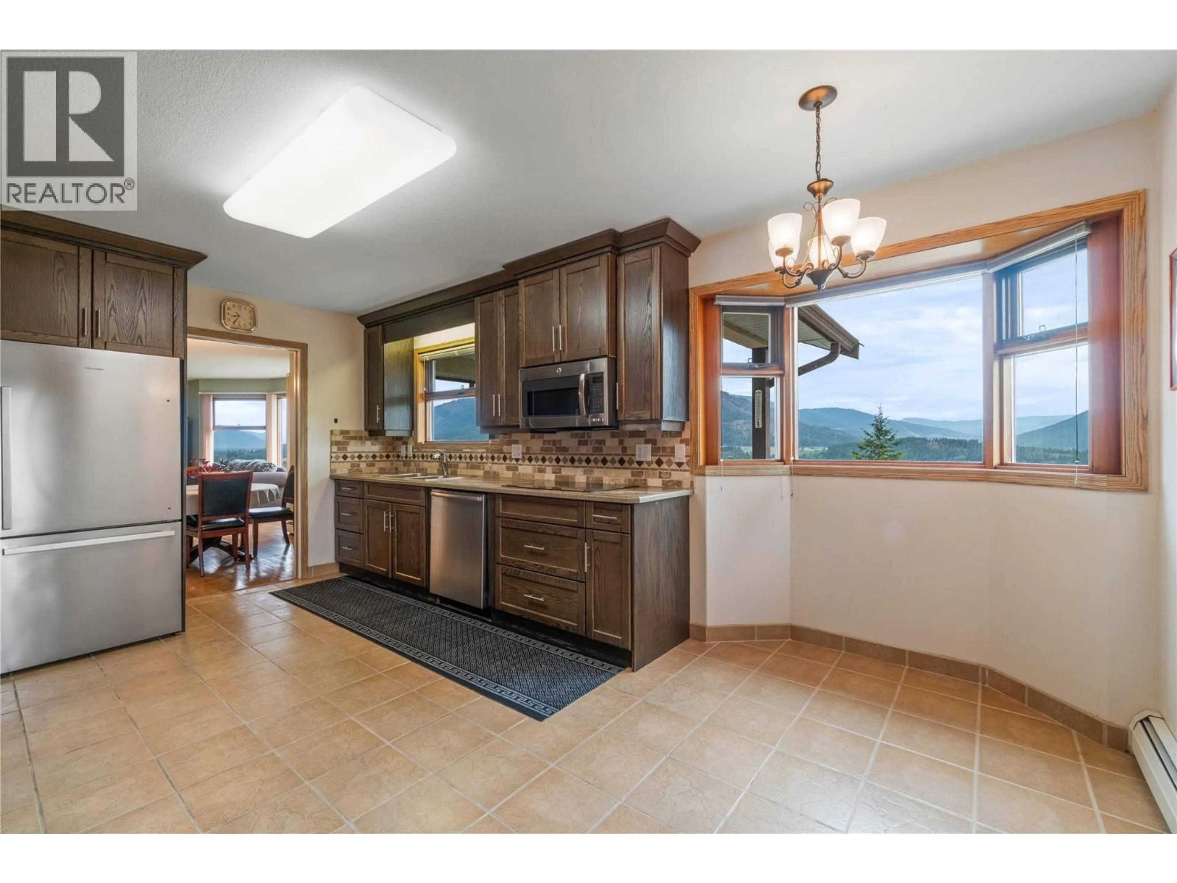 Open concept kitchen, ceramic/tile floor for 1200 LAWES STREET, Enderby British Columbia V4Y4B7