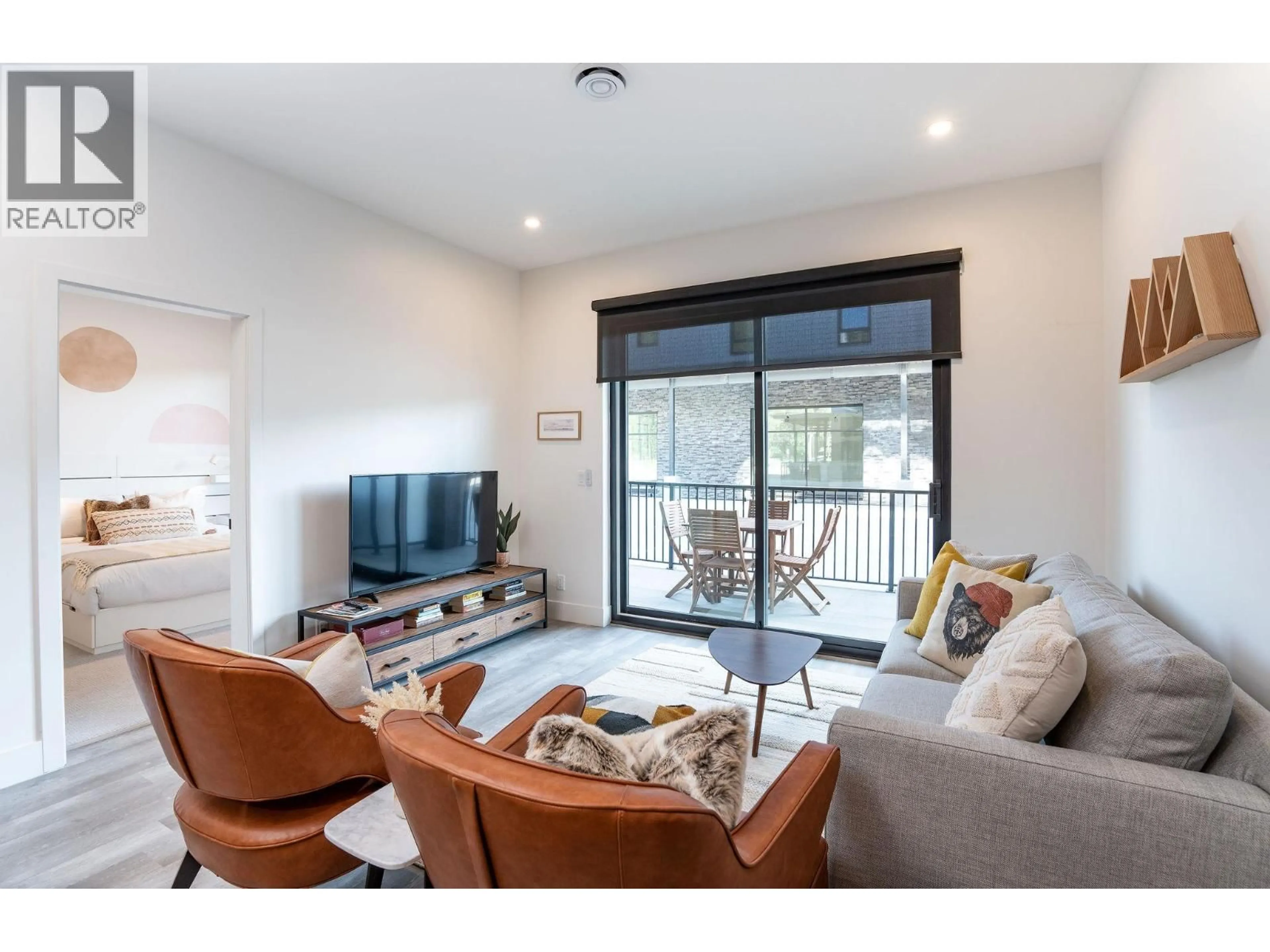 Living room with furniture, wood/laminate floor for 1107 - 1701 COURSIER AVENUE, Revelstoke British Columbia V0E2S3