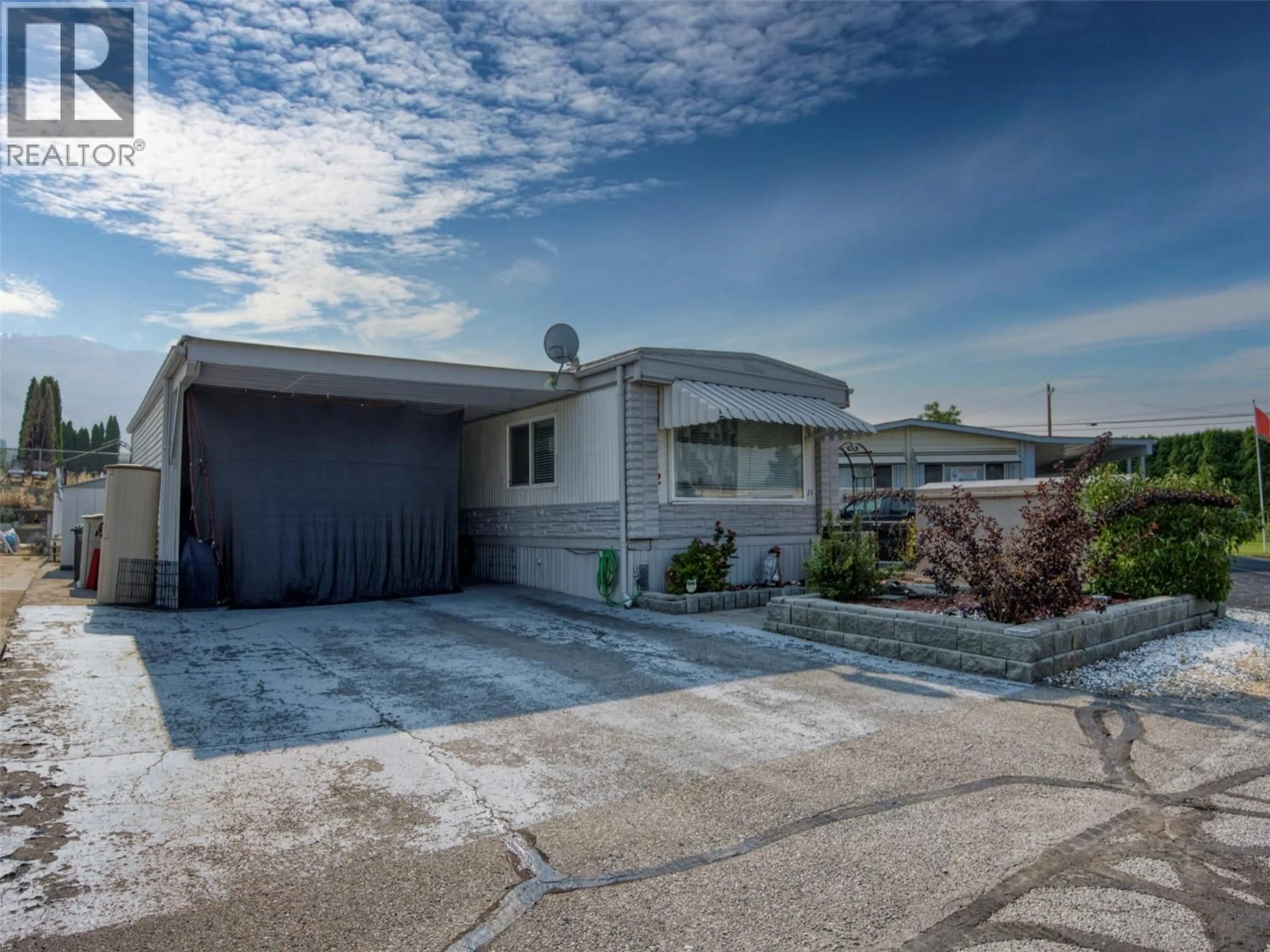 Home with vinyl exterior material, street for 21 - 4911 CEDAR LANE, Osoyoos British Columbia V0H1V3