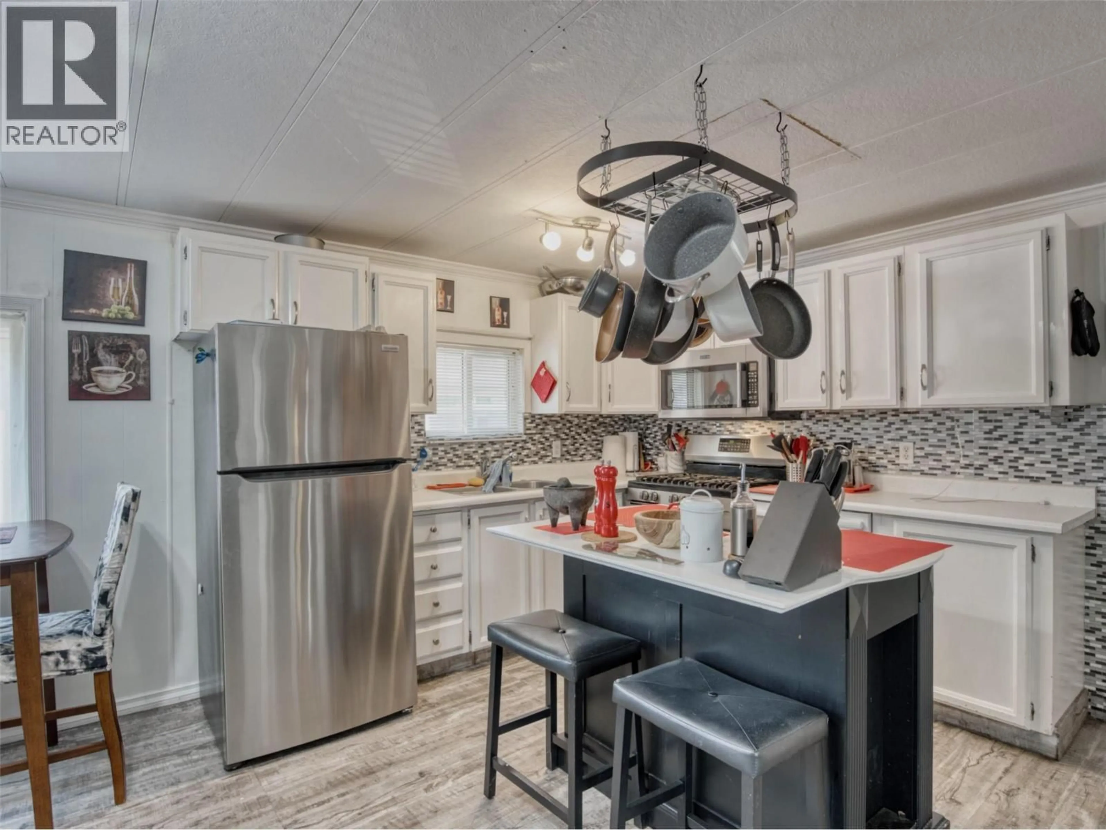 Open concept kitchen, ceramic/tile floor for 21 - 4911 CEDAR LANE, Osoyoos British Columbia V0H1V3