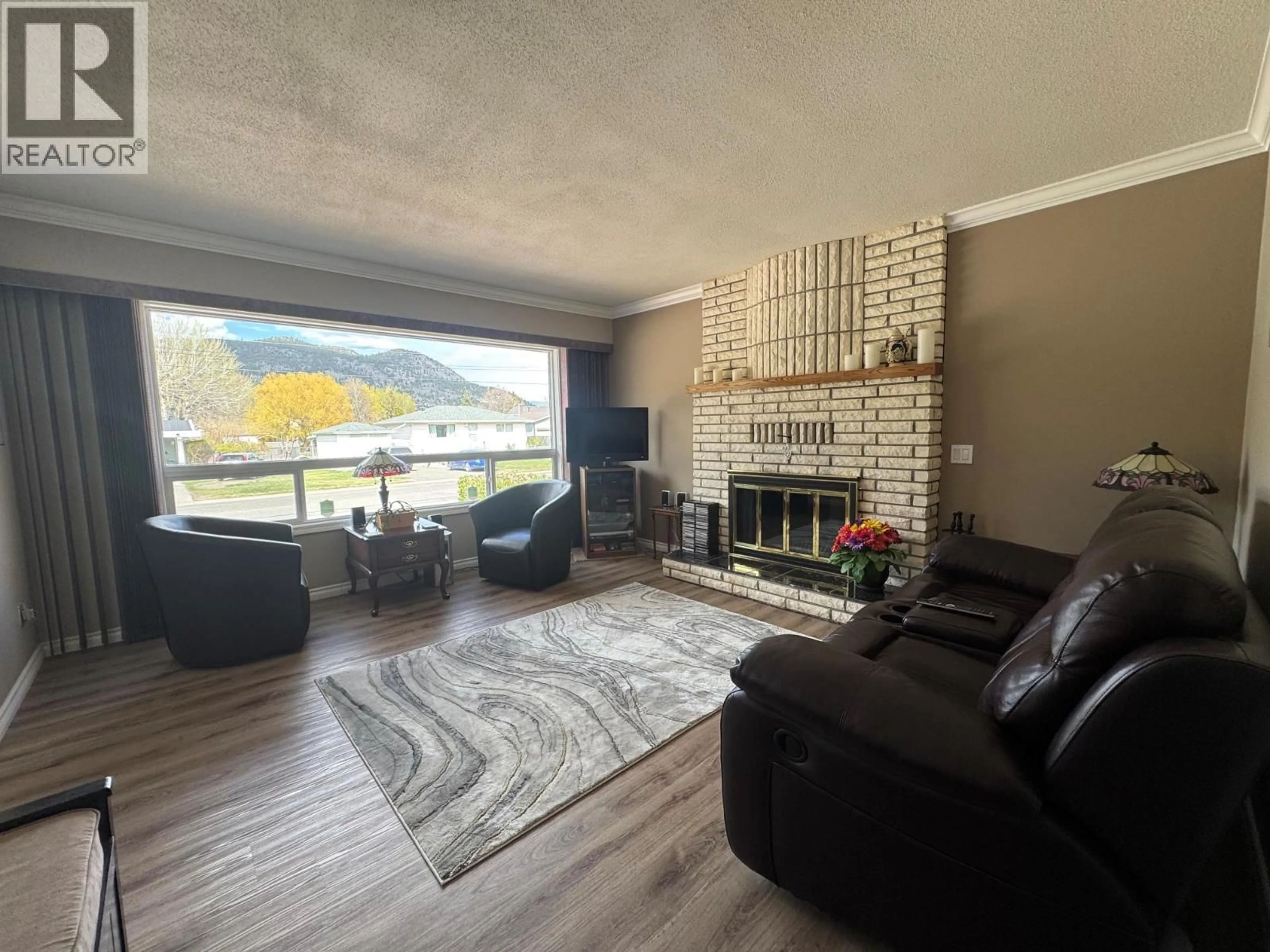 Living room with furniture, wood/laminate floor for 2176 MERRITT AVENUE, Merritt British Columbia V1K1B8