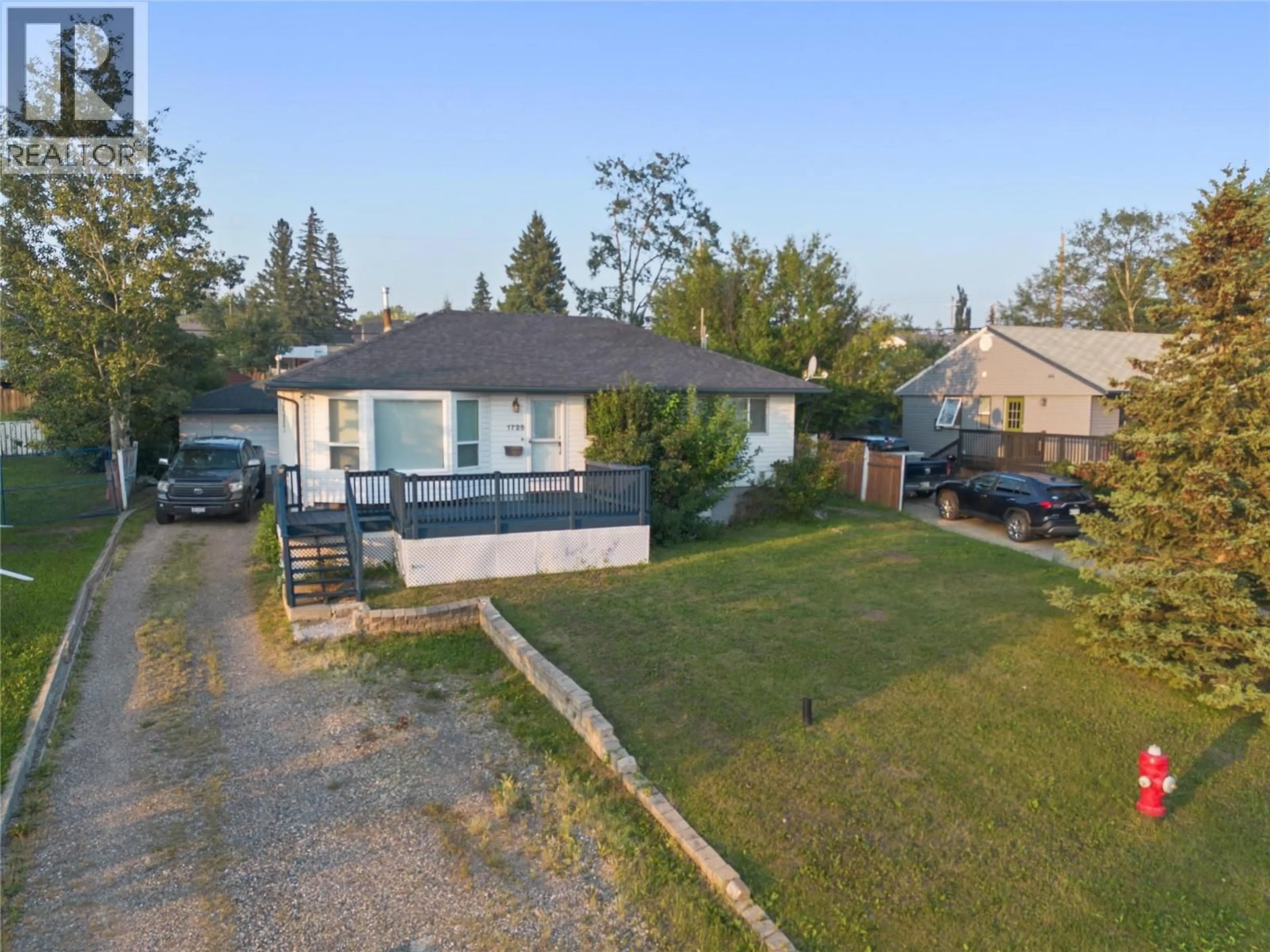 A pic from outside/outdoor area/front of a property/back of a property/a pic from drone, street for 1728 93 AVENUE, Dawson Creek British Columbia V1G1E6