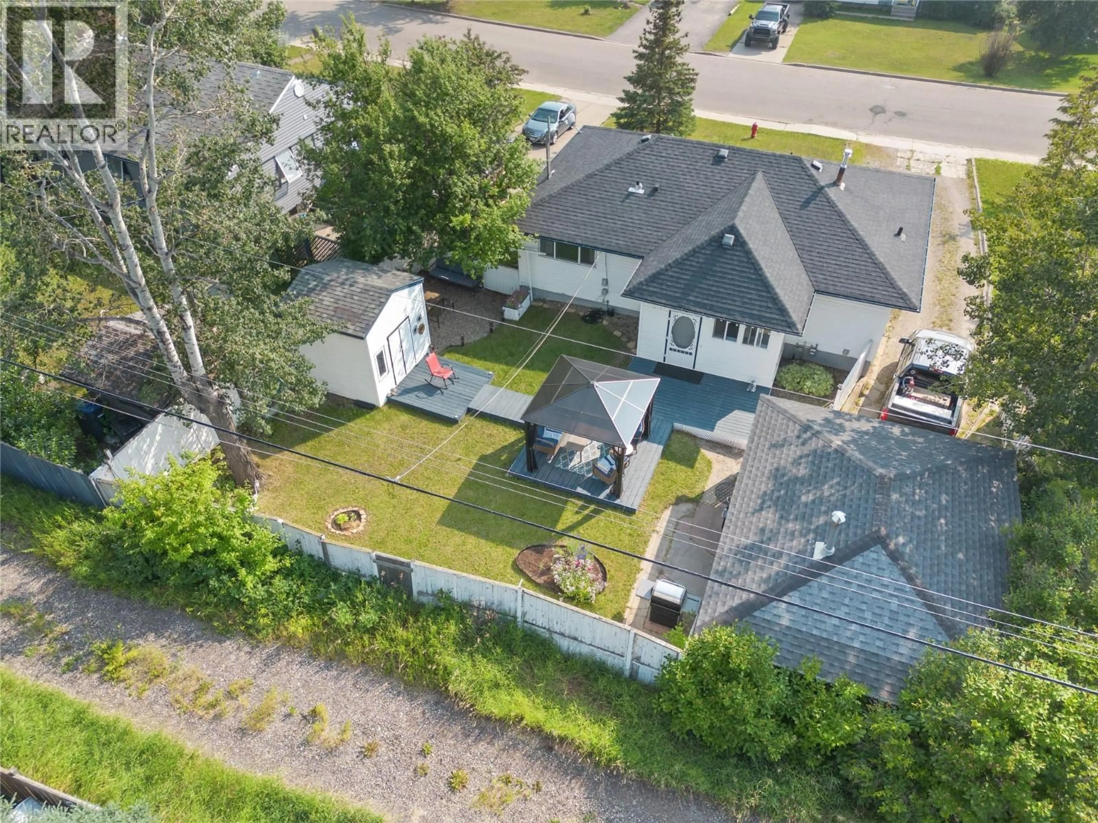 A pic from outside/outdoor area/front of a property/back of a property/a pic from drone, street for 1728 93 AVENUE, Dawson Creek British Columbia V1G1E6