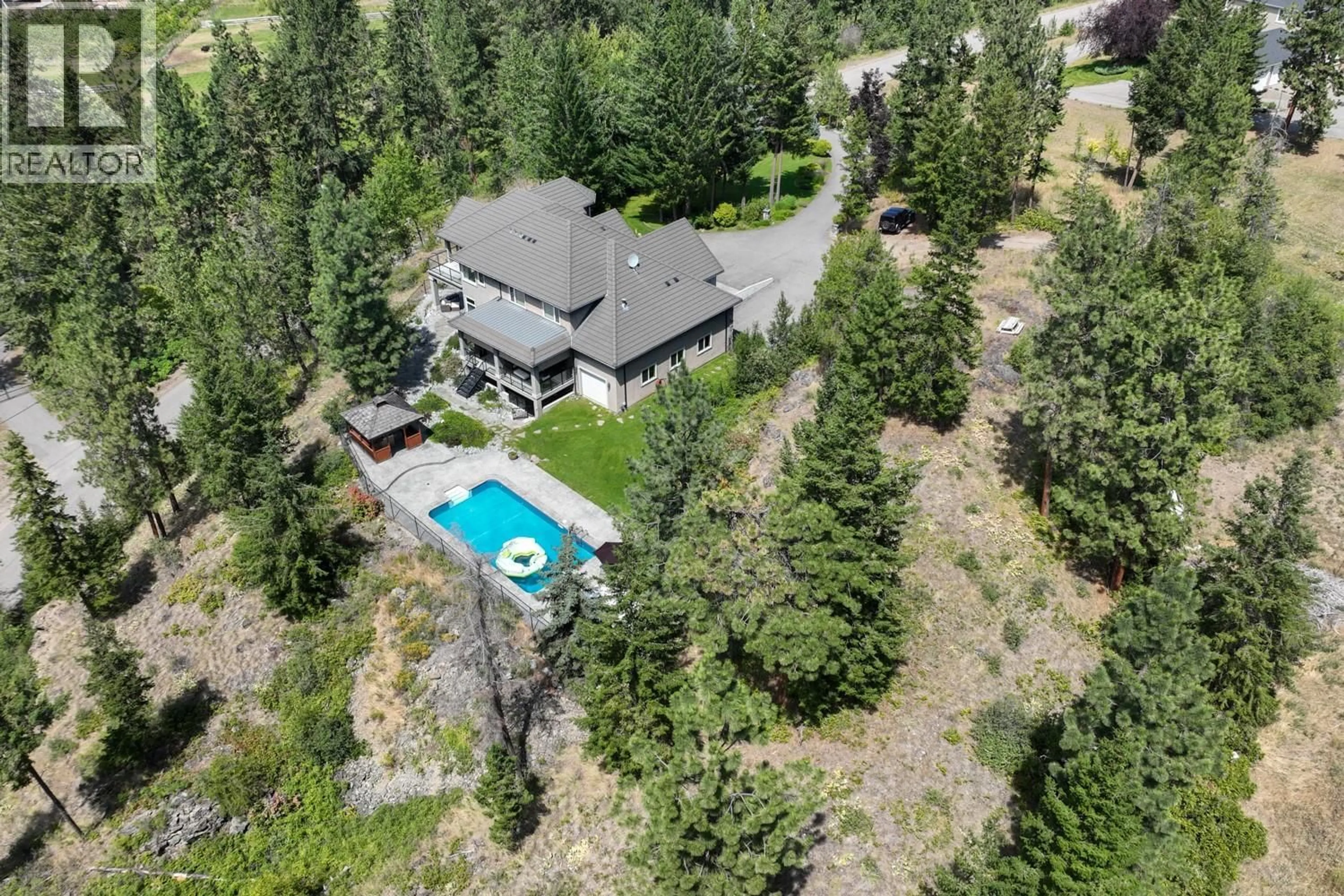 A pic from outside/outdoor area/front of a property/back of a property/a pic from drone, mountain view for 2615 HARVARD ROAD, Kelowna British Columbia V1W4C2