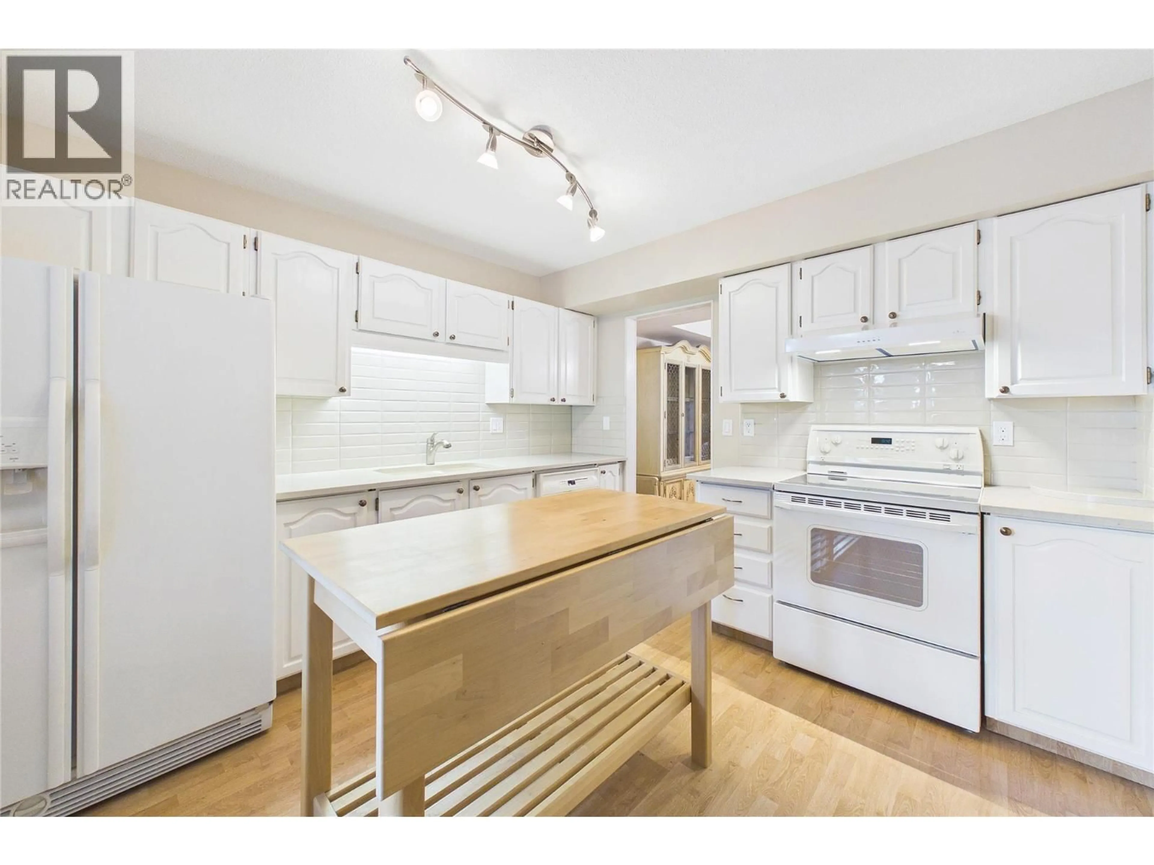 Standard kitchen, wood/laminate floor for 105 - 1995 BURTCH ROAD, Kelowna British Columbia V1Y4B4