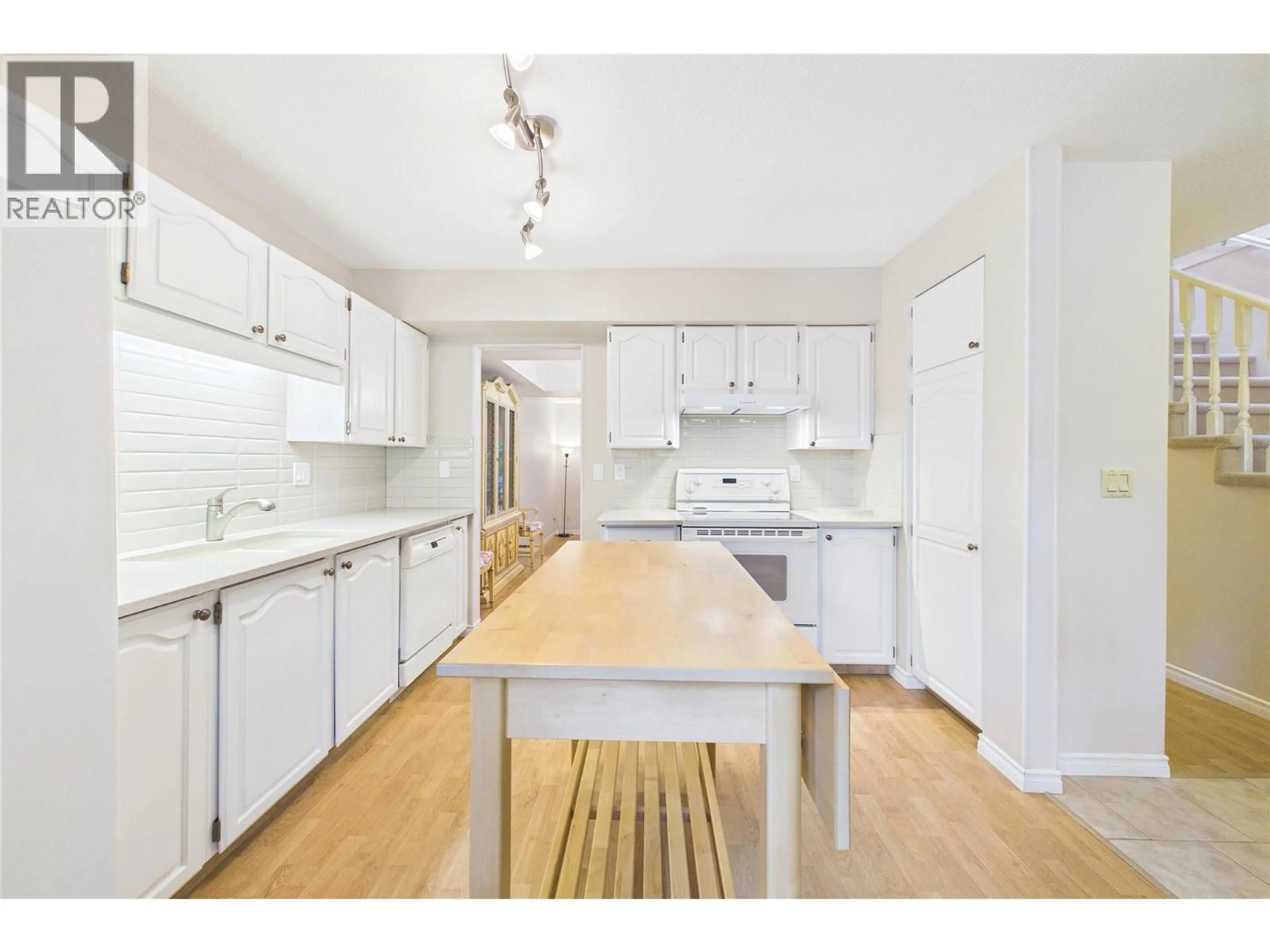 Open concept kitchen, wood/laminate floor for 105 - 1995 BURTCH ROAD, Kelowna British Columbia V1Y4B4
