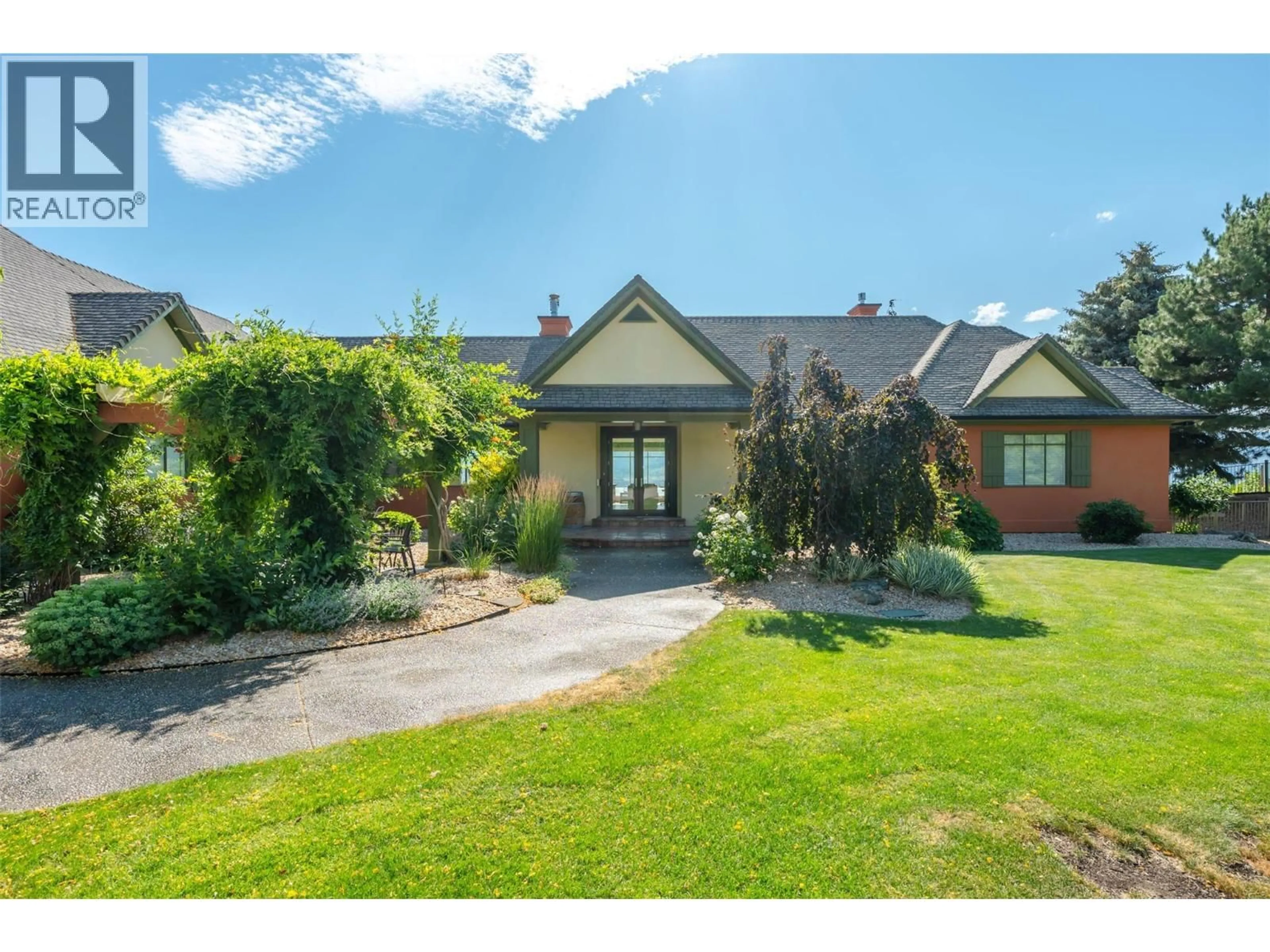 A pic from outside/outdoor area/front of a property/back of a property/a pic from drone, street for 1145 CHAPMAN ROAD, Penticton British Columbia V2A8T6
