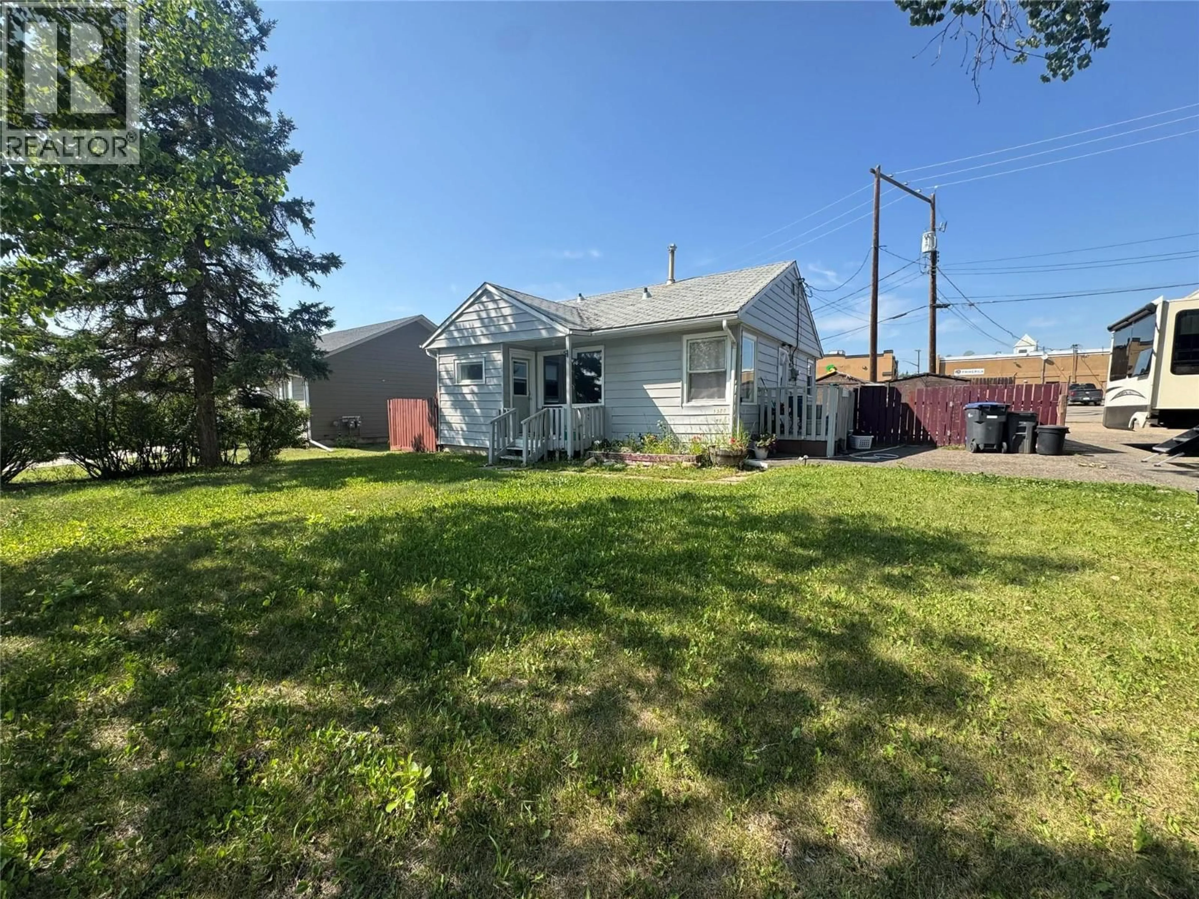 A pic from outside/outdoor area/front of a property/back of a property/a pic from drone, street for 1500 99 AVENUE, Dawson Creek British Columbia V1G1T7