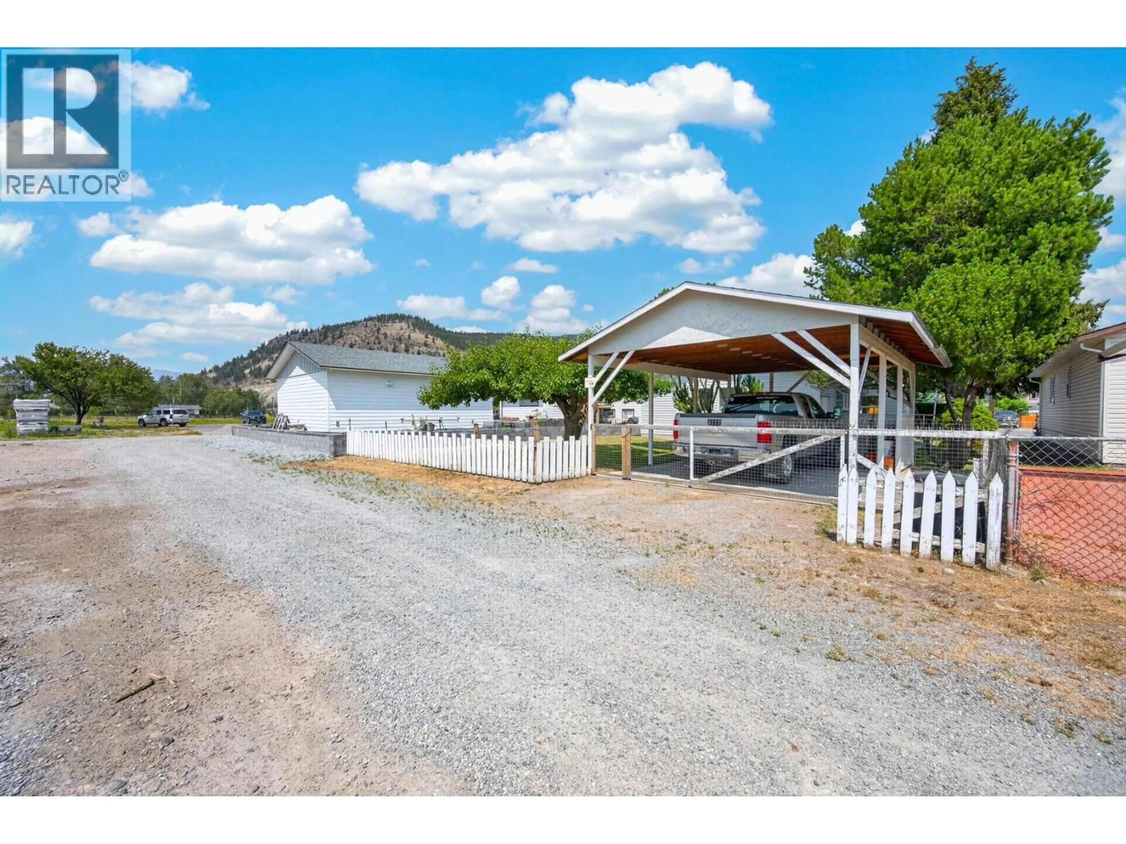 A pic from outside/outdoor area/front of a property/back of a property/a pic from drone, mountain view for 1540 CANFORD AVENUE, Merritt British Columbia V1K1B8
