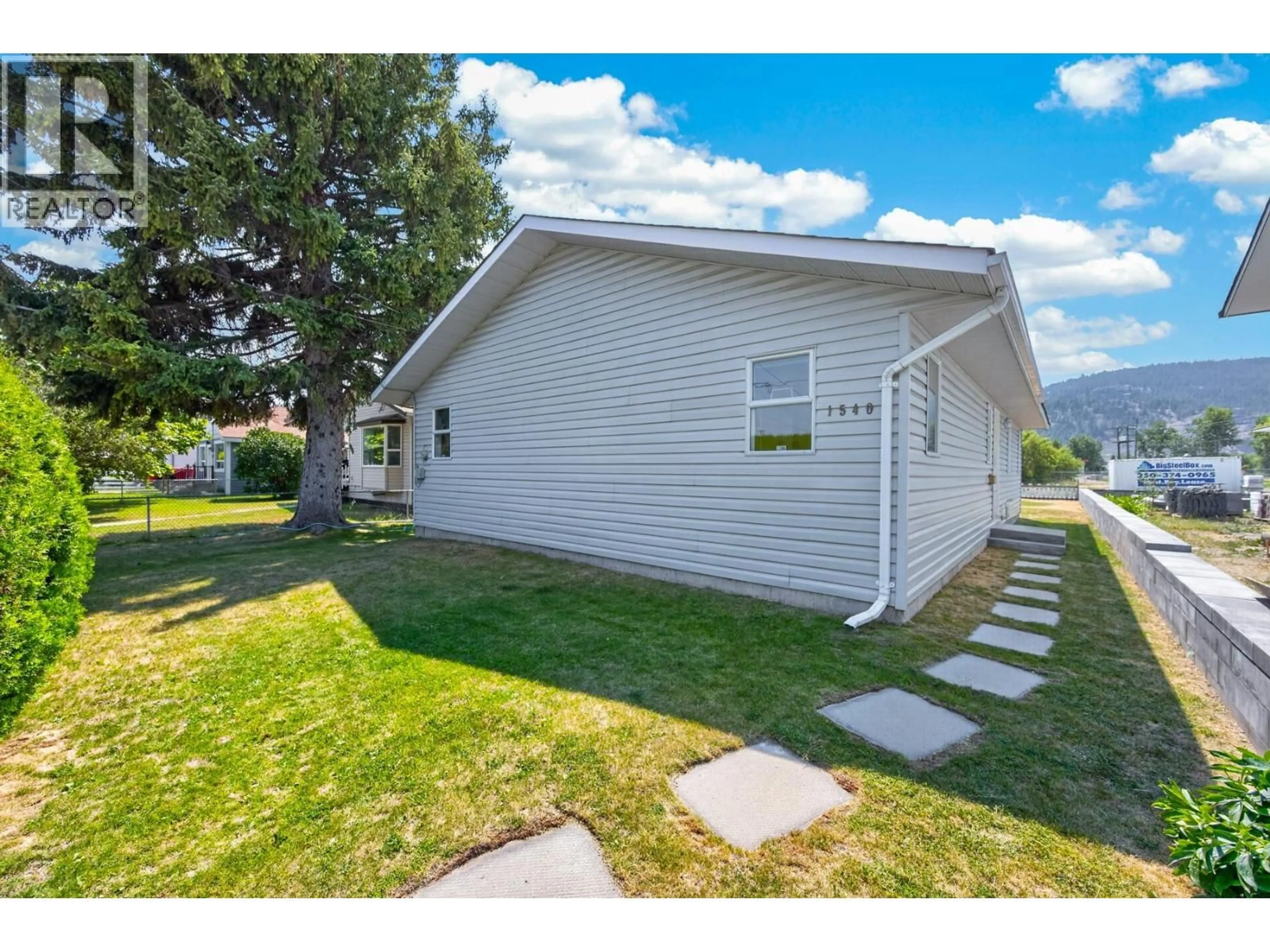Home with vinyl exterior material, street for 1540 CANFORD AVENUE, Merritt British Columbia V1K1B8