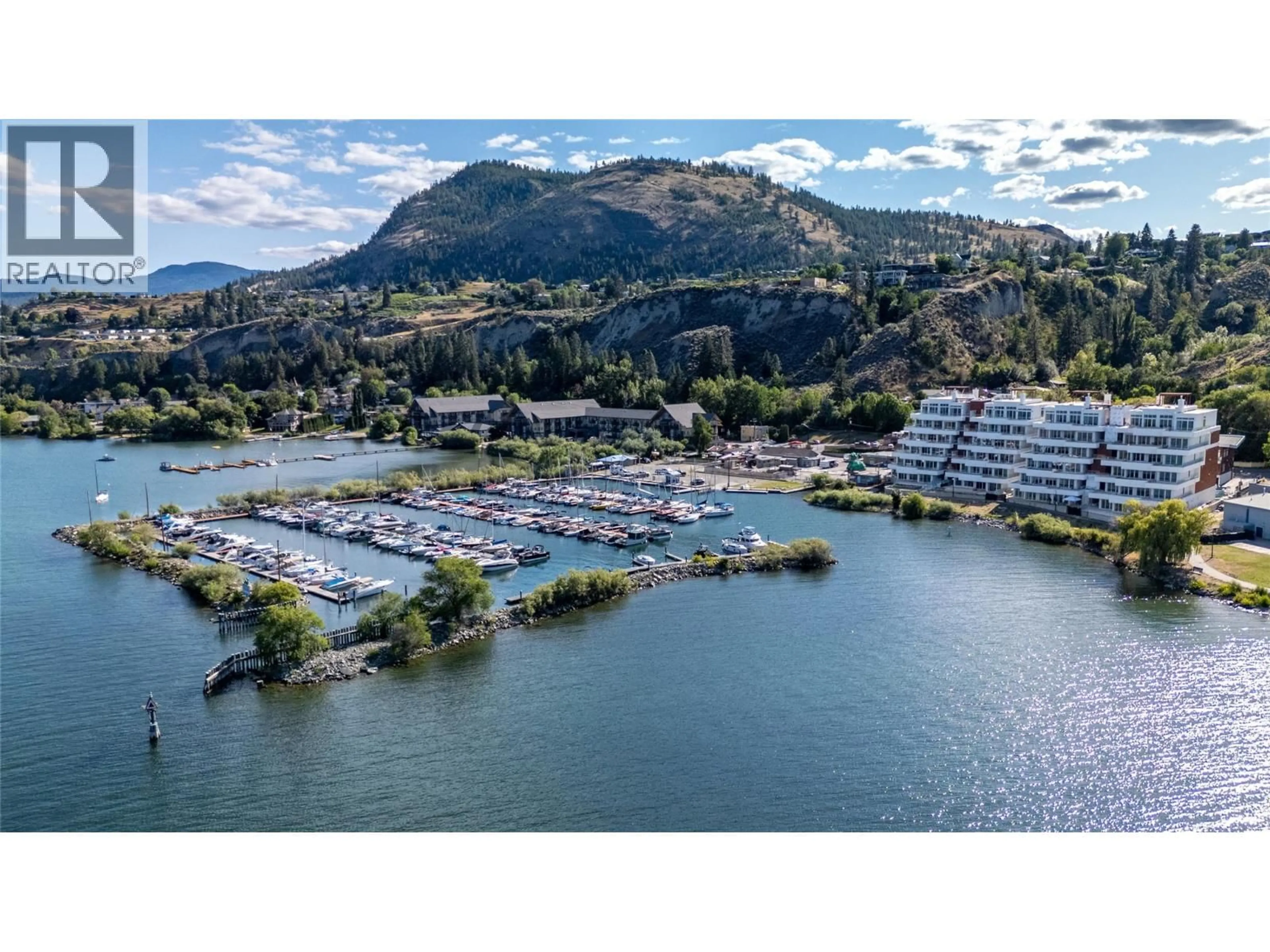 A pic from outside/outdoor area/front of a property/back of a property/a pic from drone, water/lake/river/ocean view for 401 - 13415 LAKESHORE DRIVE SOUTH, Summerland British Columbia V0H1Z1