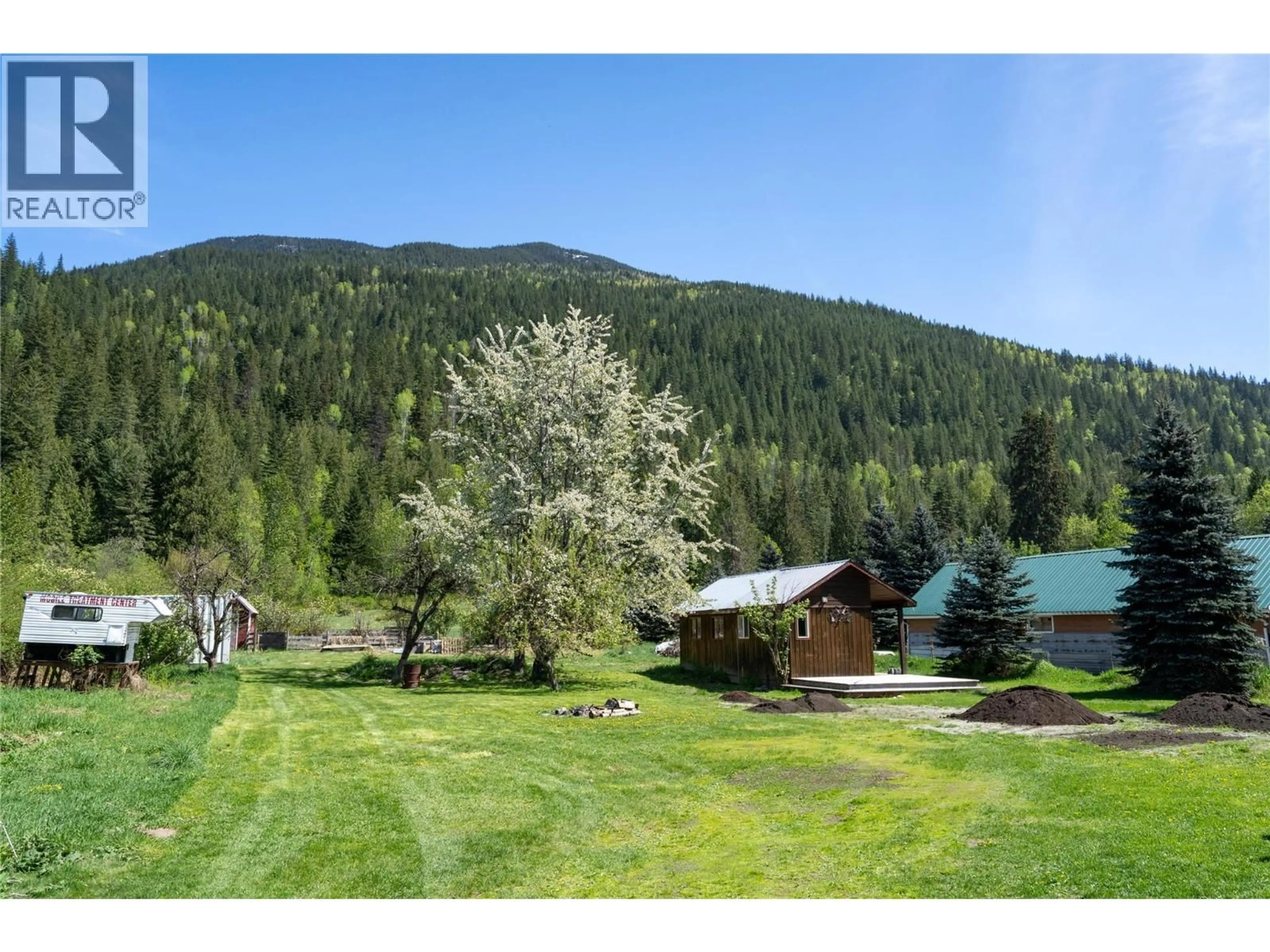 A pic from outside/outdoor area/front of a property/back of a property/a pic from drone, mountain view for 1918 CAMOZZI ROAD, Revelstoke British Columbia V0E2S0