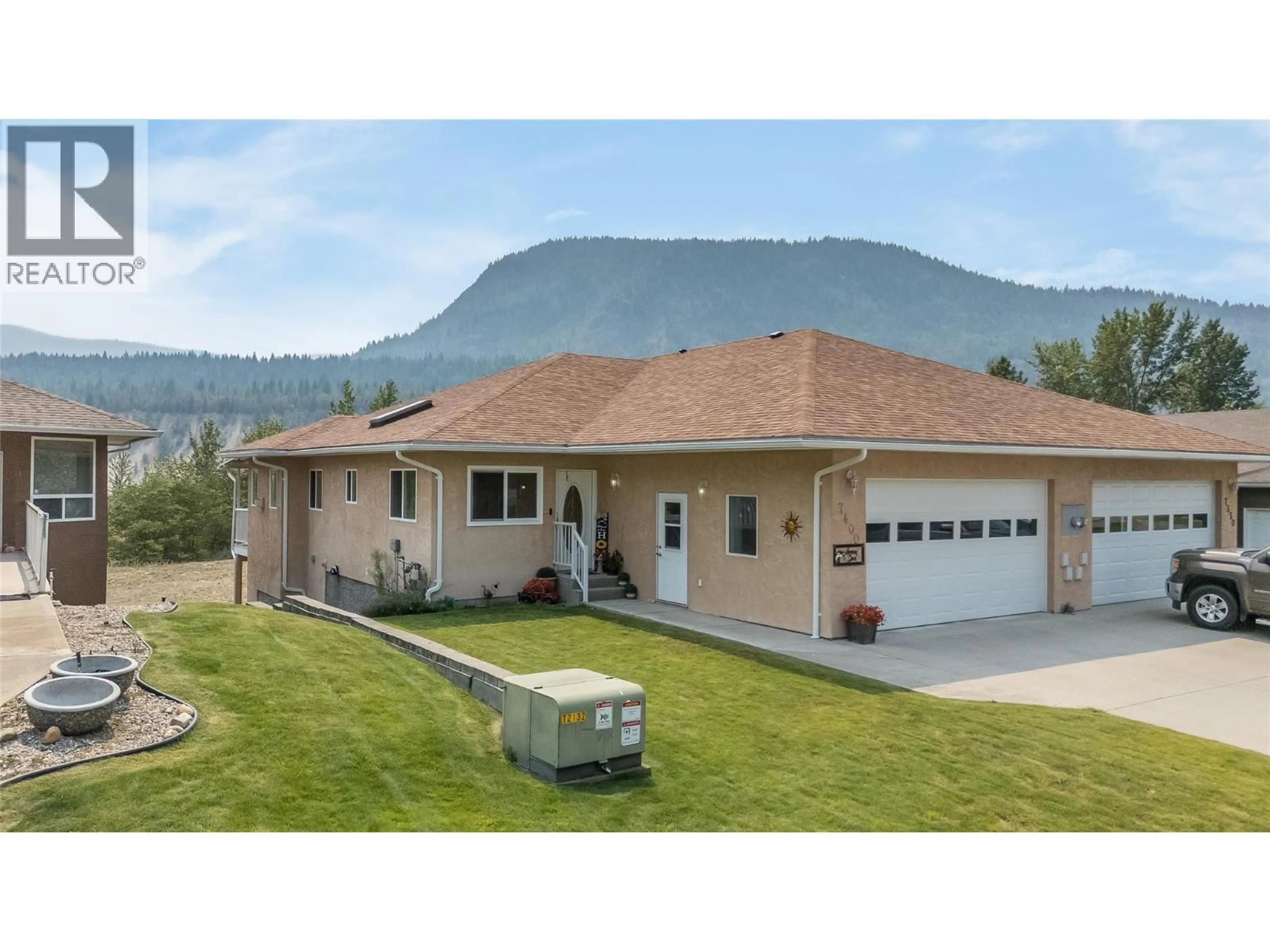 A pic from outside/outdoor area/front of a property/back of a property/a pic from drone, mountain view for 7400 CREMA DRIVE, Trail British Columbia V1R4X6