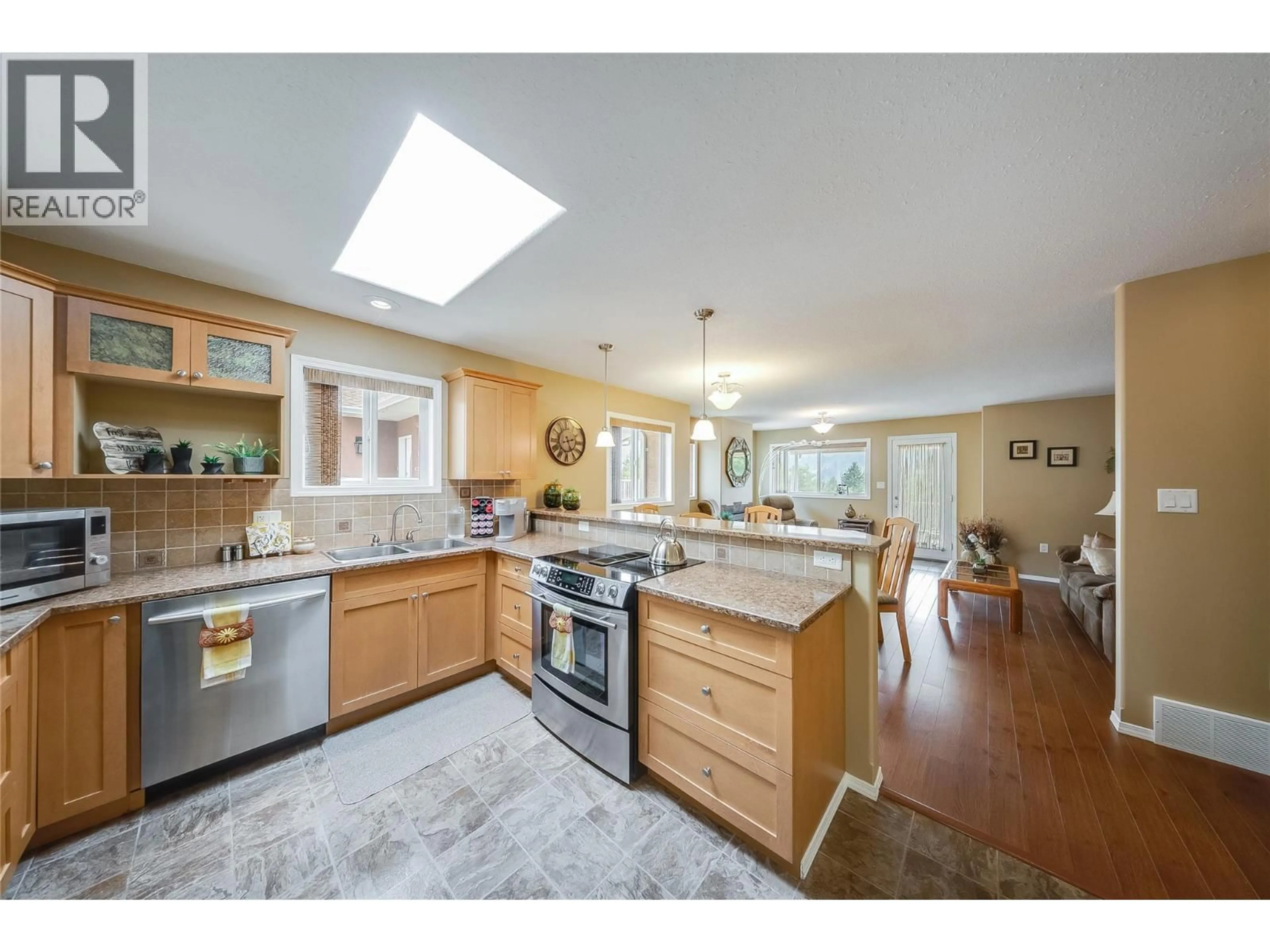Open concept kitchen, ceramic/tile floor for 7400 CREMA DRIVE, Trail British Columbia V1R4X6