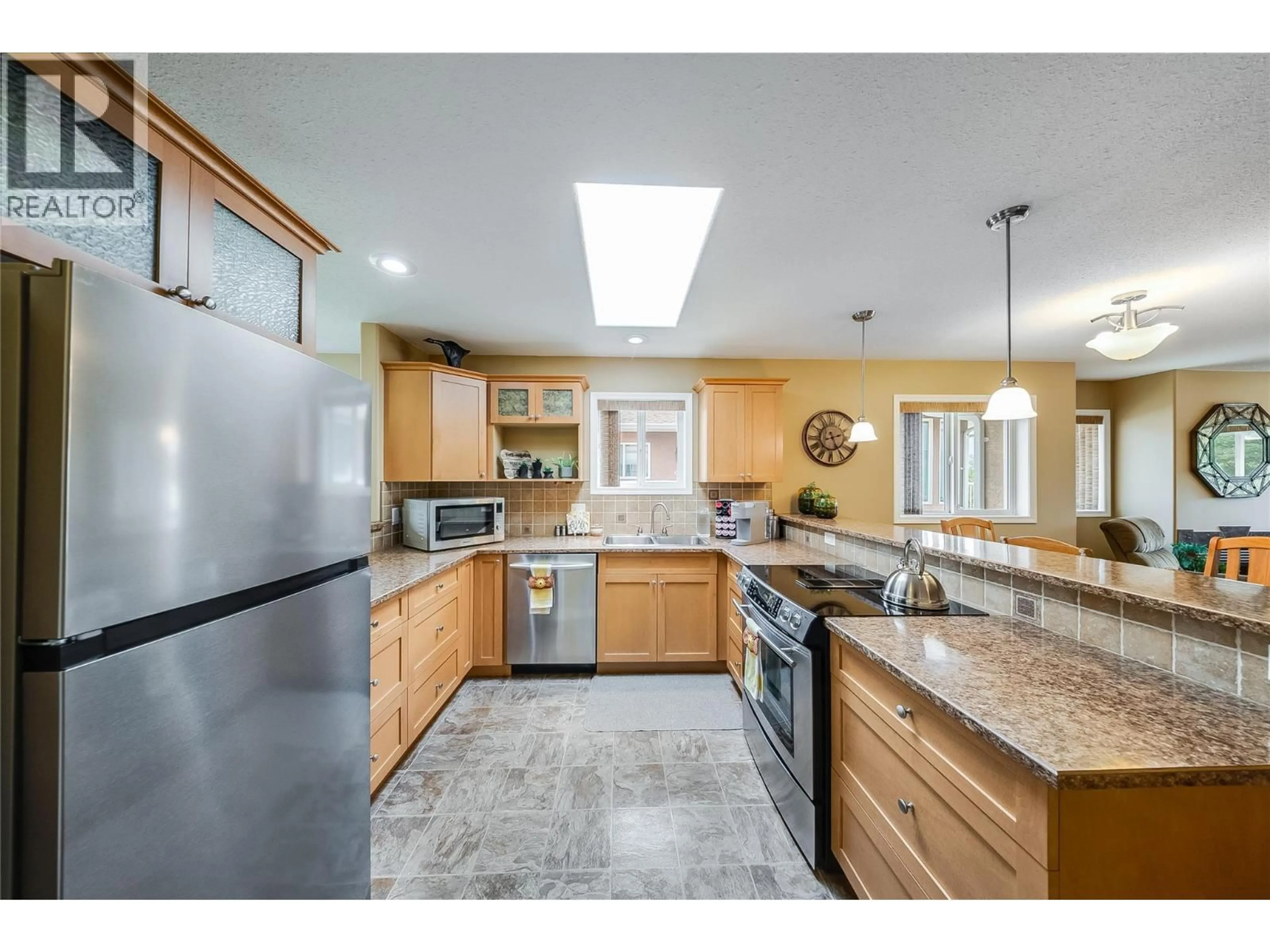 Open concept kitchen, ceramic/tile floor for 7400 CREMA DRIVE, Trail British Columbia V1R4X6