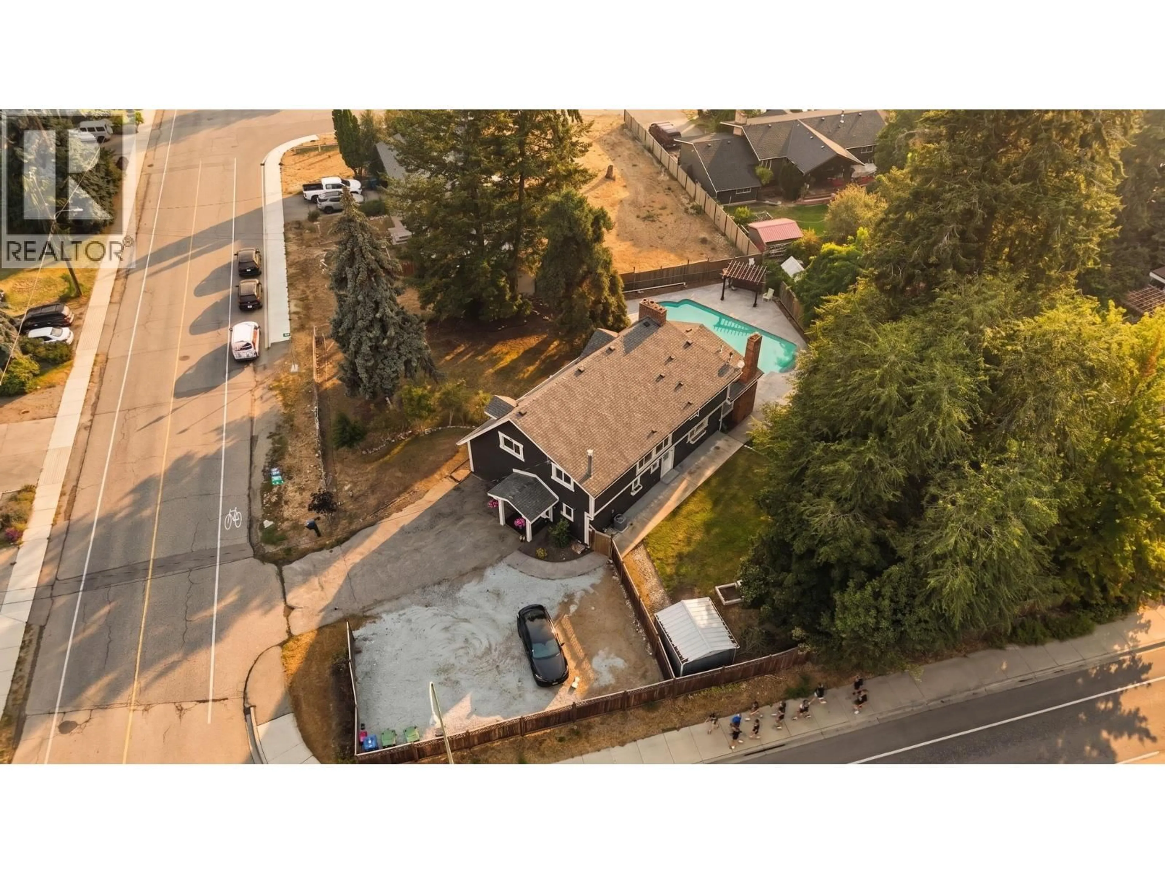 A pic from outside/outdoor area/front of a property/back of a property/a pic from drone, street for 694 MCCLURE ROAD, Kelowna British Columbia V1W1M1