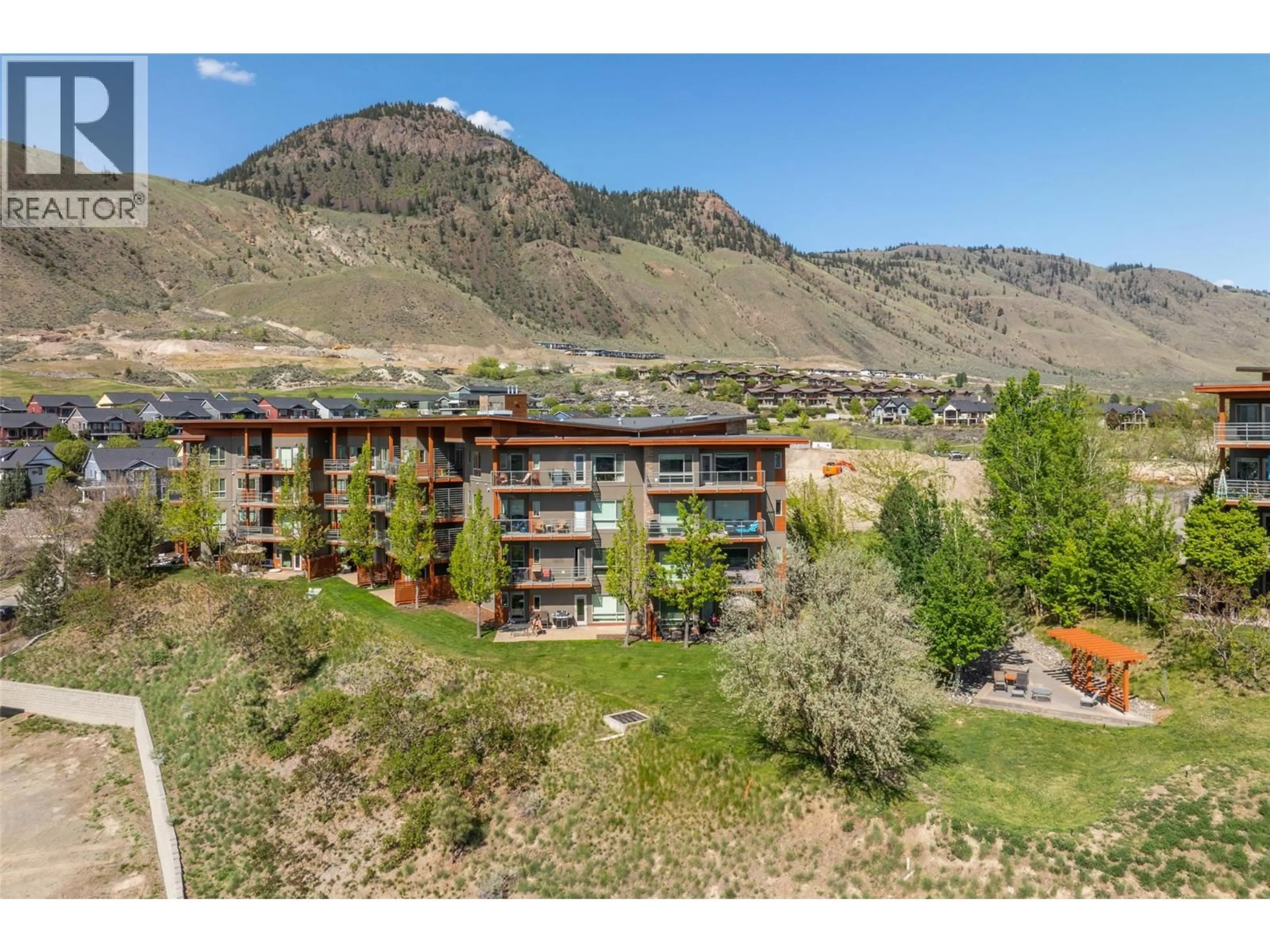 A pic from outside/outdoor area/front of a property/back of a property/a pic from drone, mountain view for 1306 - 1000 TALASA WAY, Kamloops British Columbia V2H0C2