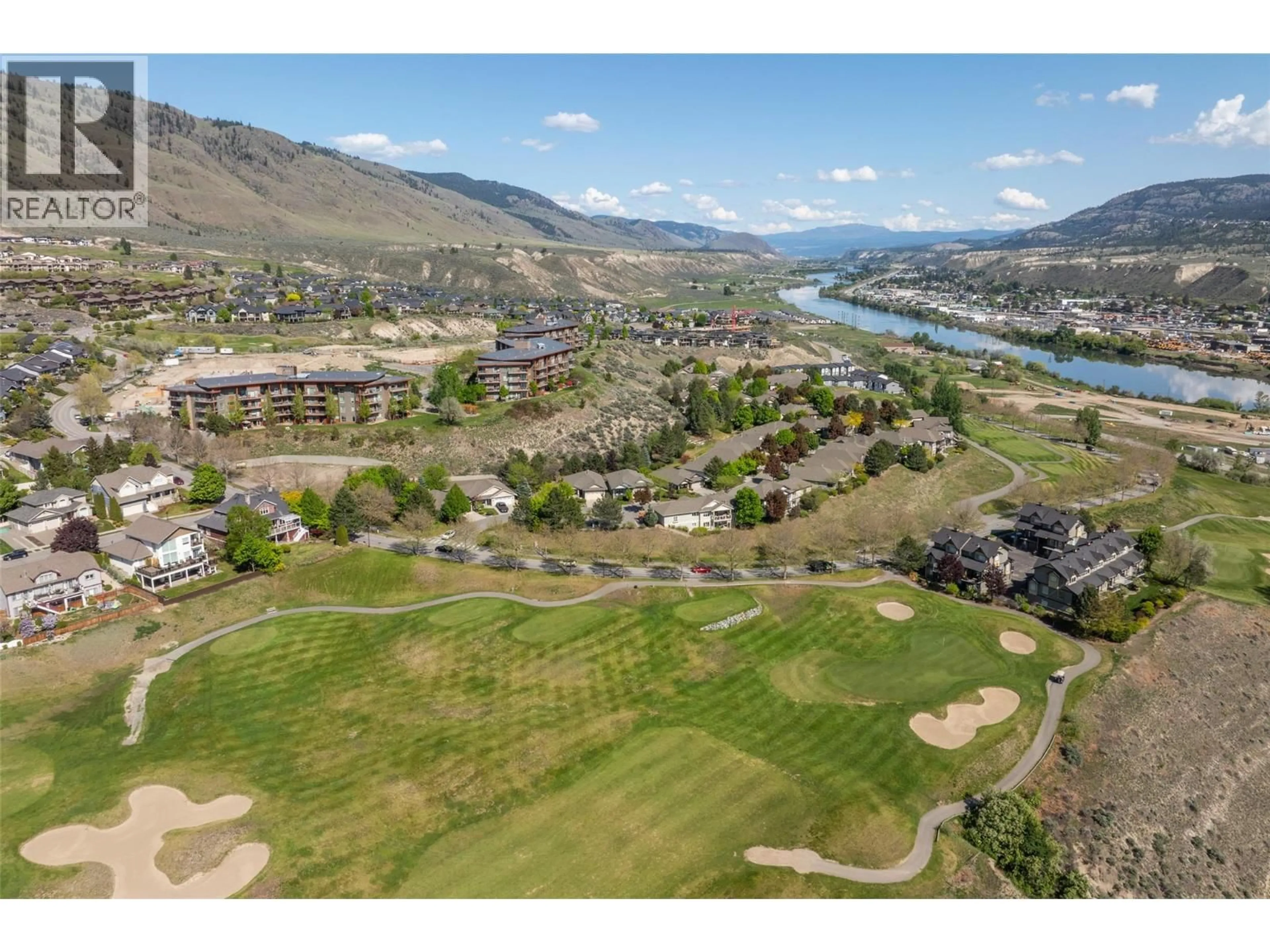 A pic from outside/outdoor area/front of a property/back of a property/a pic from drone, mountain view for 1306 - 1000 TALASA WAY, Kamloops British Columbia V2H0C2