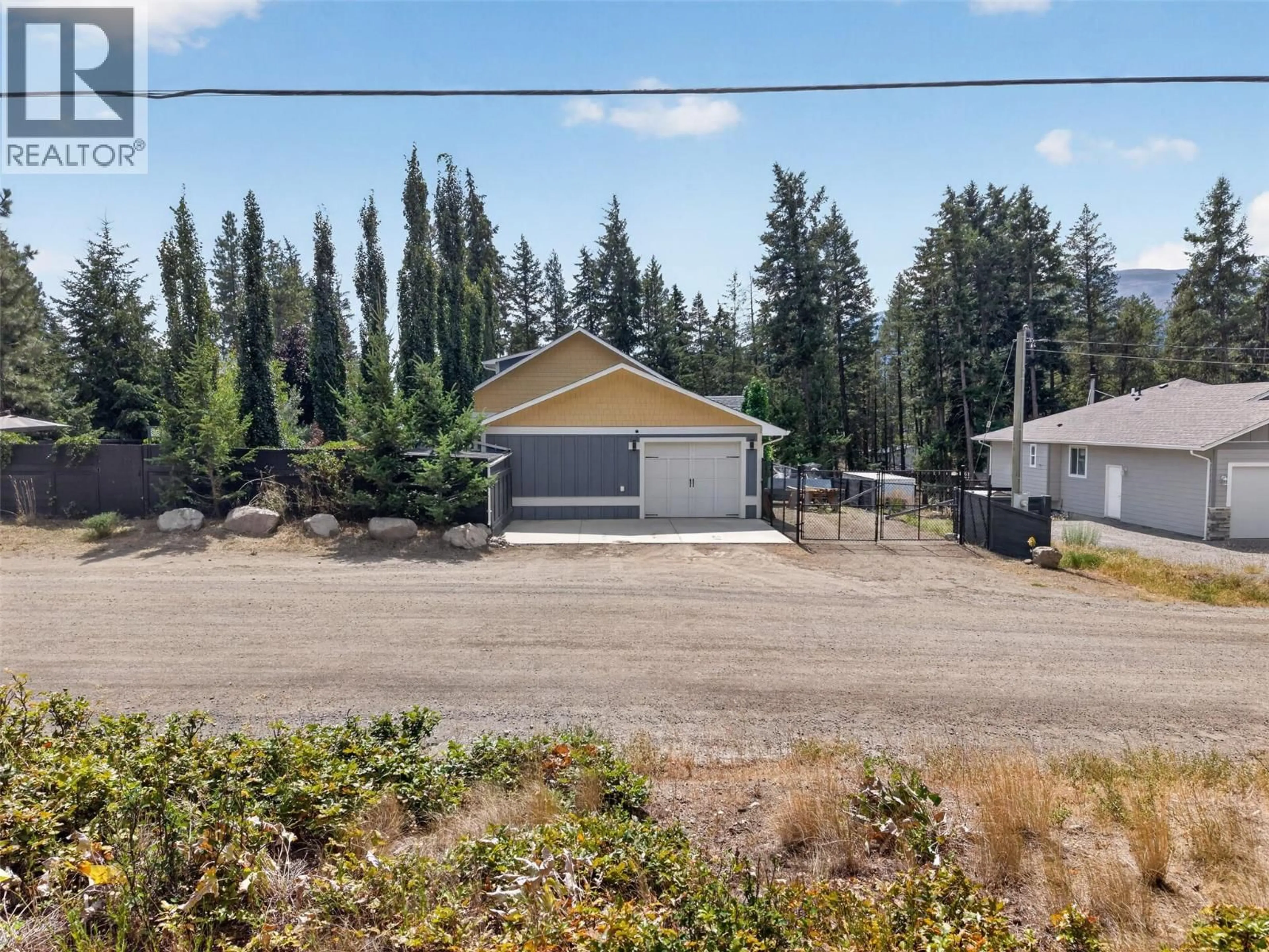 A pic from outside/outdoor area/front of a property/back of a property/a pic from drone, street for 7272 DUNWATERS ROAD, Kelowna British Columbia V1Z3W4