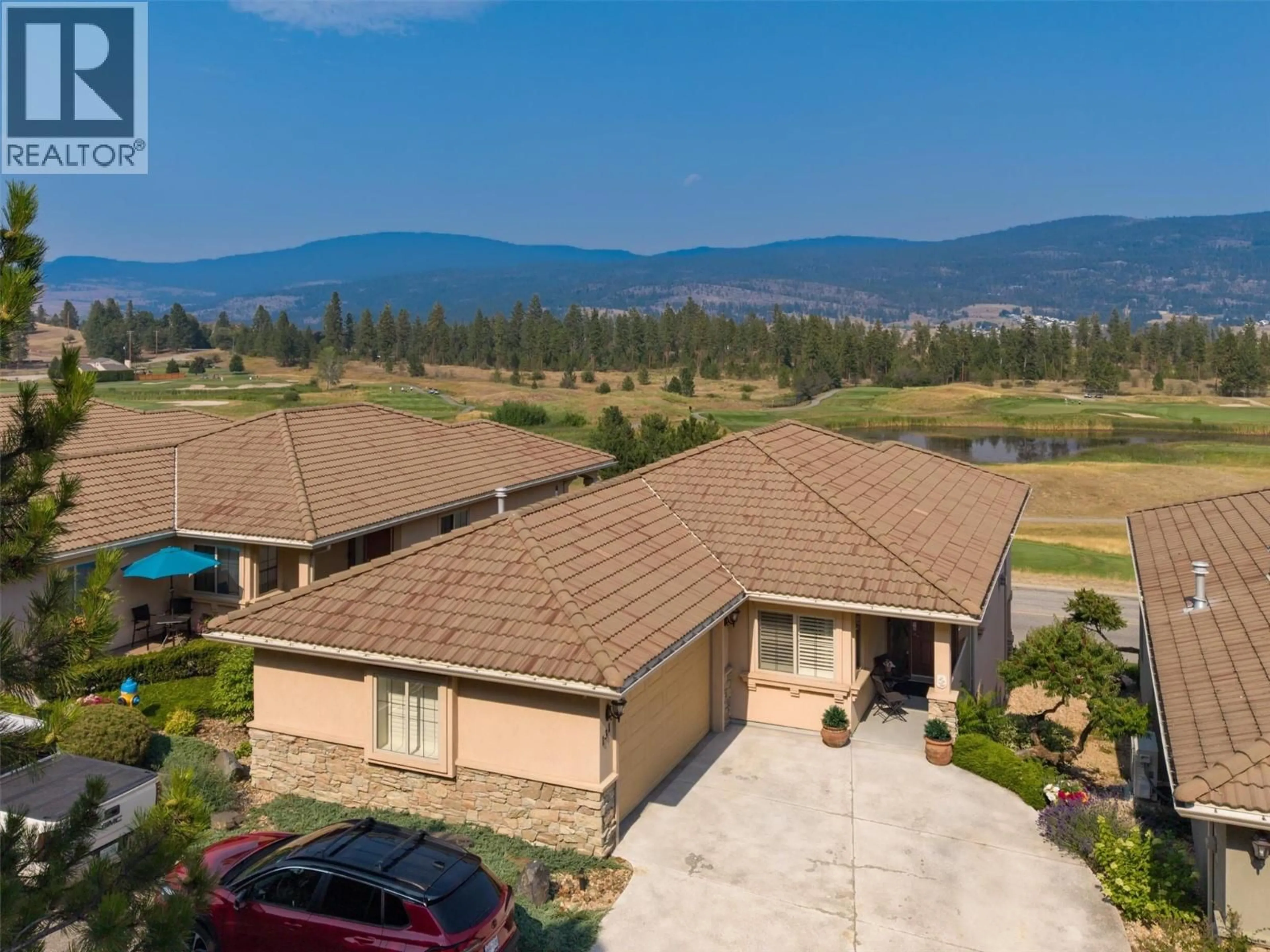 A pic from outside/outdoor area/front of a property/back of a property/a pic from drone, mountain view for 131 - 2455 QUAIL RIDGE BOULEVARD, Kelowna British Columbia V1V2S8