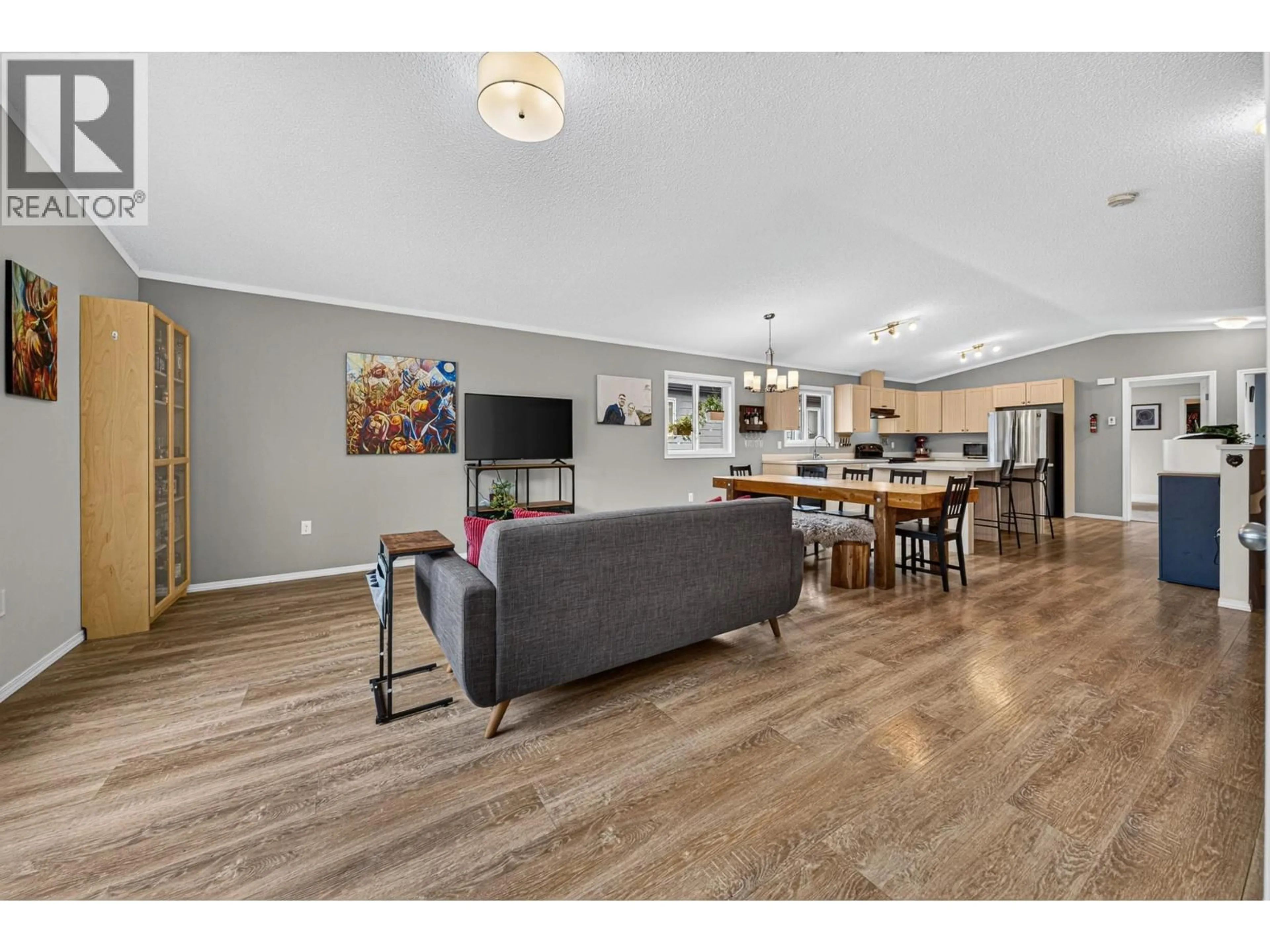 Open concept kitchen, wood/laminate floor for 2064 GOLDEN EAGLE DRIVE, Sparwood British Columbia V0B2G2