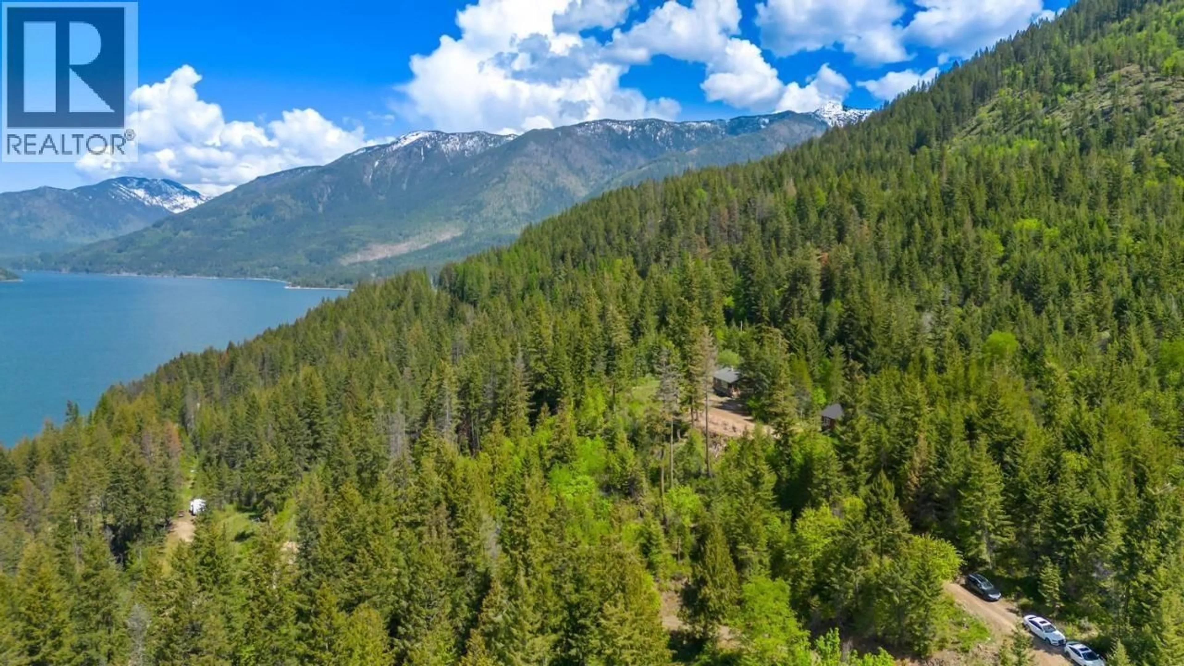 A pic from outside/outdoor area/front of a property/back of a property/a pic from drone, forest/trees view for 14504 - & 14506 3A HIGHWAY, Gray Creek British Columbia V0B1S0
