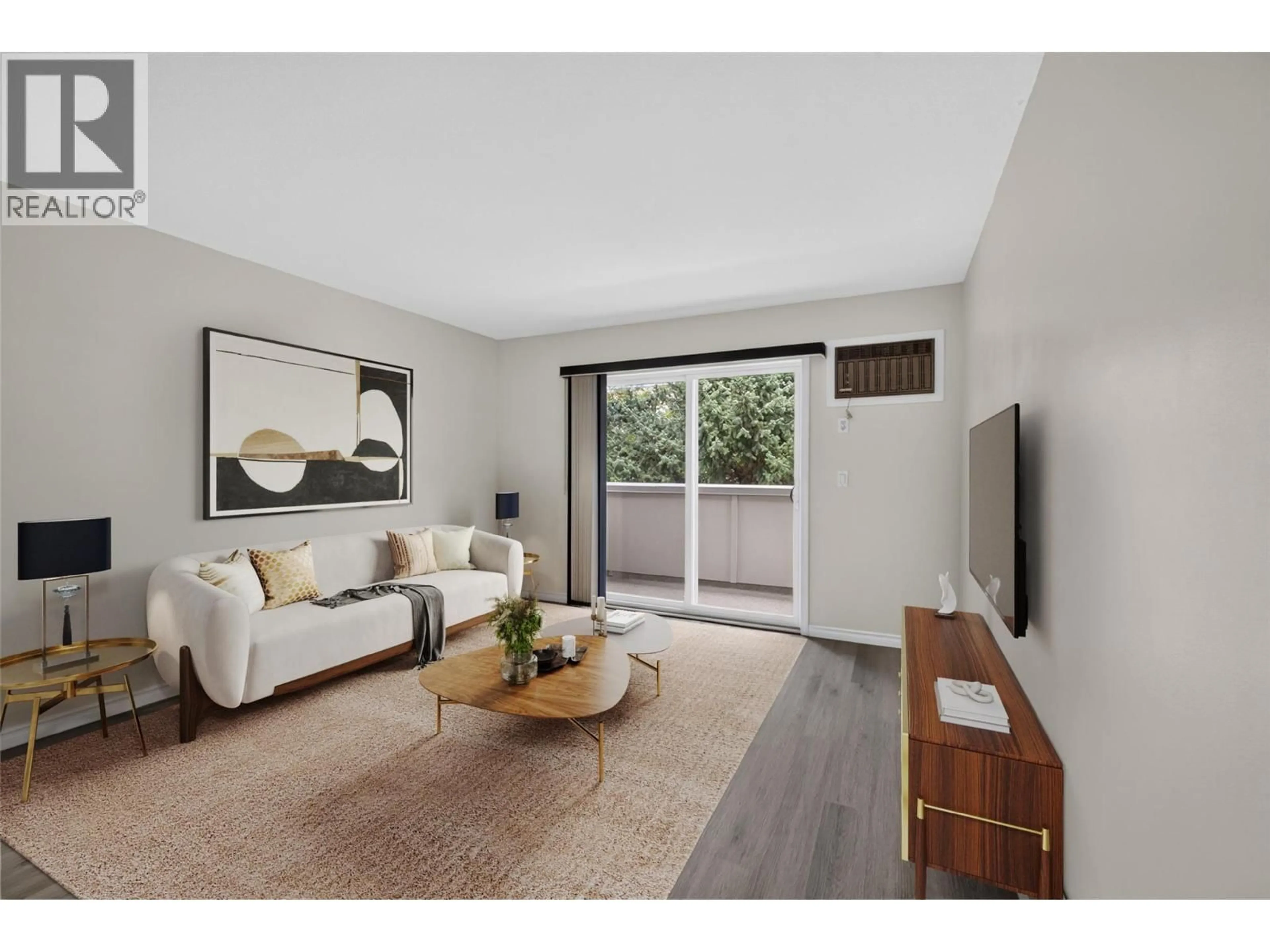 Living room with furniture, wood/laminate floor for 400 - 3160 DE MONTREUIL COURT, Kelowna British Columbia V1W3W3