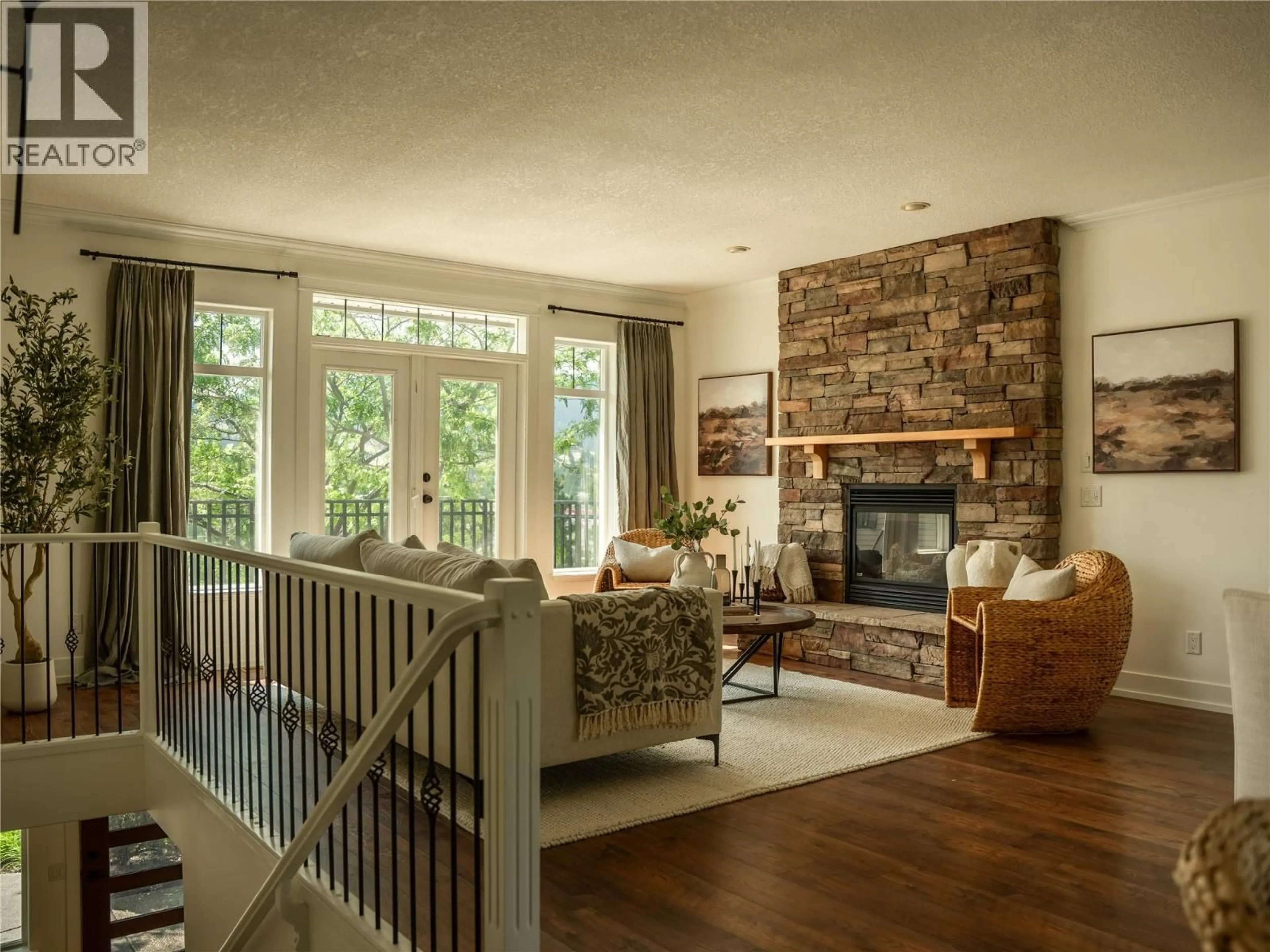 Living room with furniture, wood/laminate floor for 1357 COPPERHEAD DRIVE, Kamloops British Columbia V2E2T4