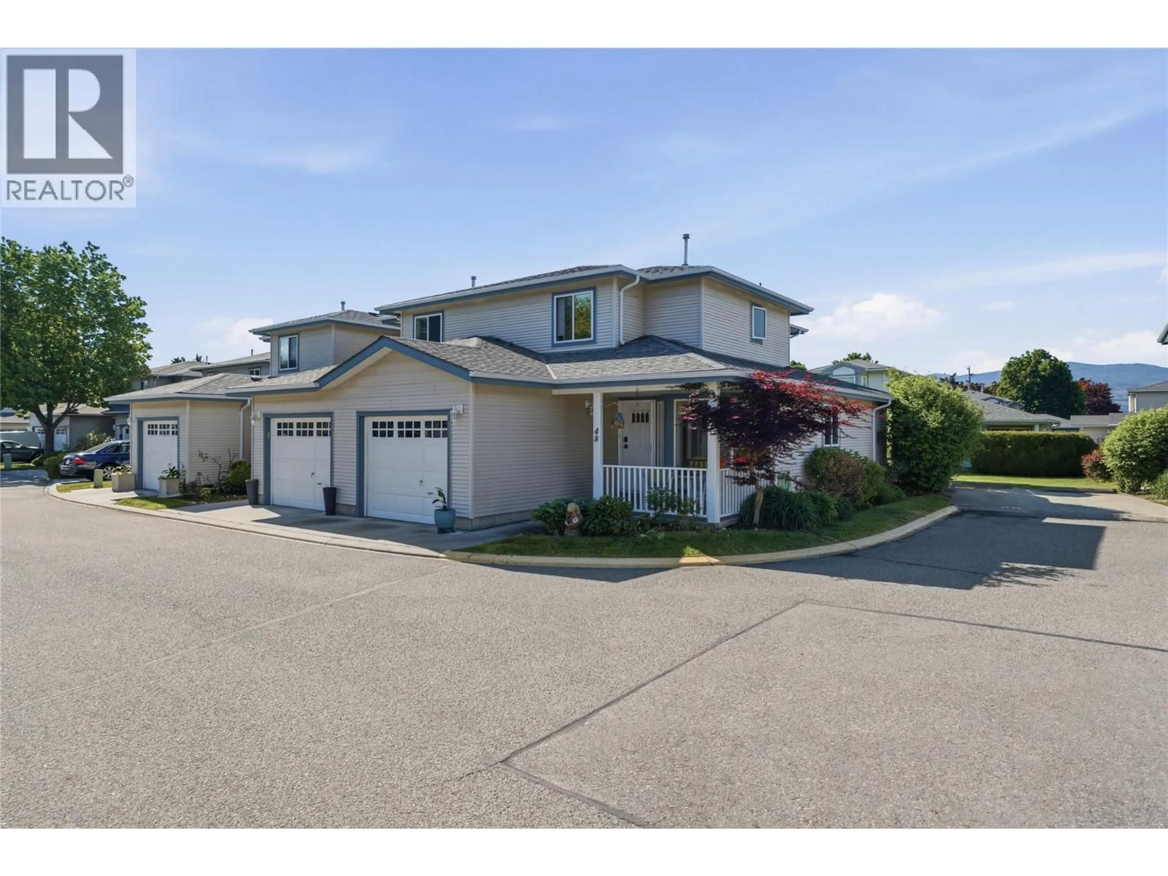 A pic from outside/outdoor area/front of a property/back of a property/a pic from drone, street for 48 - 1120 GUISACHAN ROAD, Kelowna British Columbia V1Y9R5