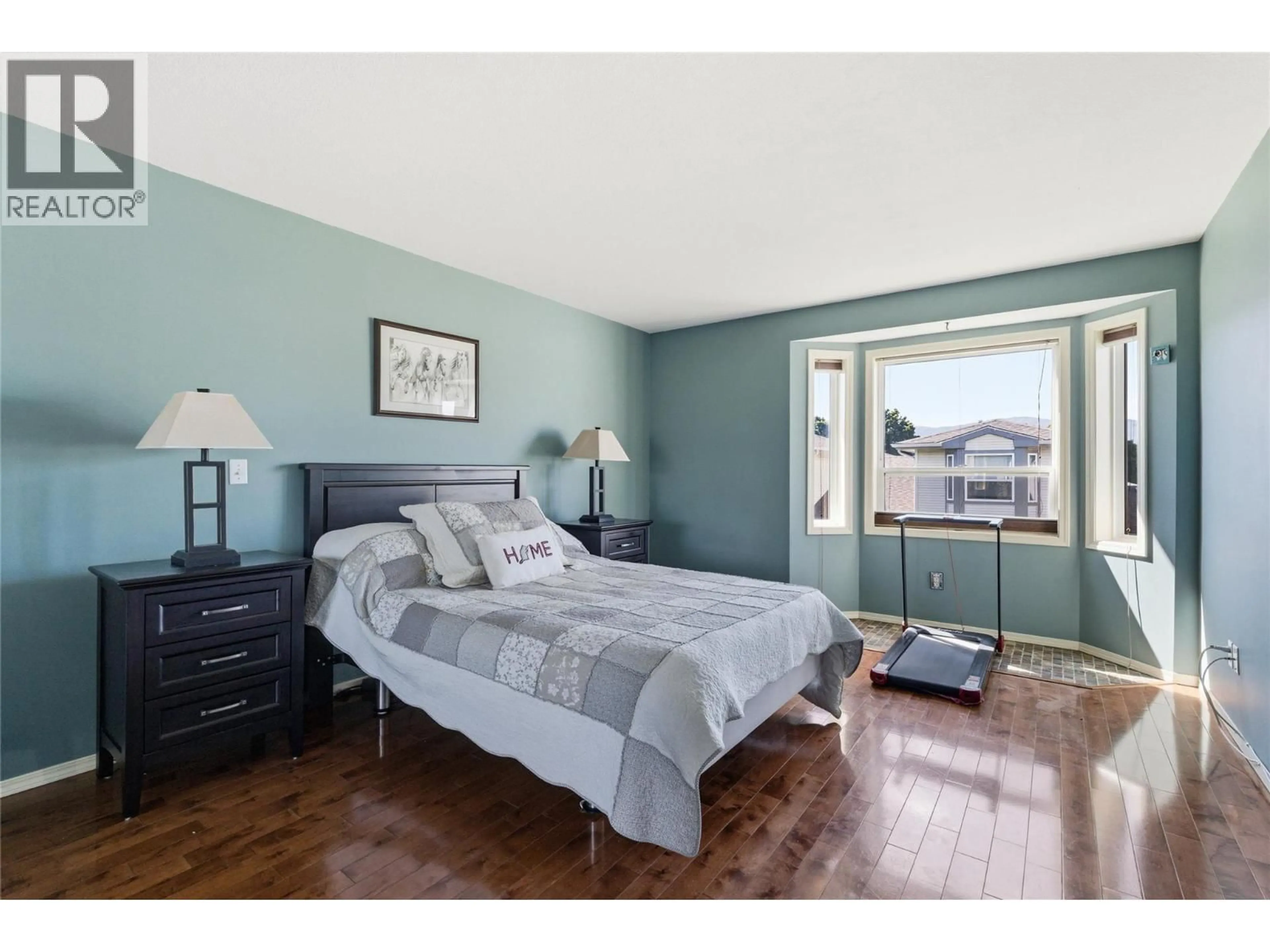Bedroom with bed, wood/laminate floor for 48 - 1120 GUISACHAN ROAD, Kelowna British Columbia V1Y9R5