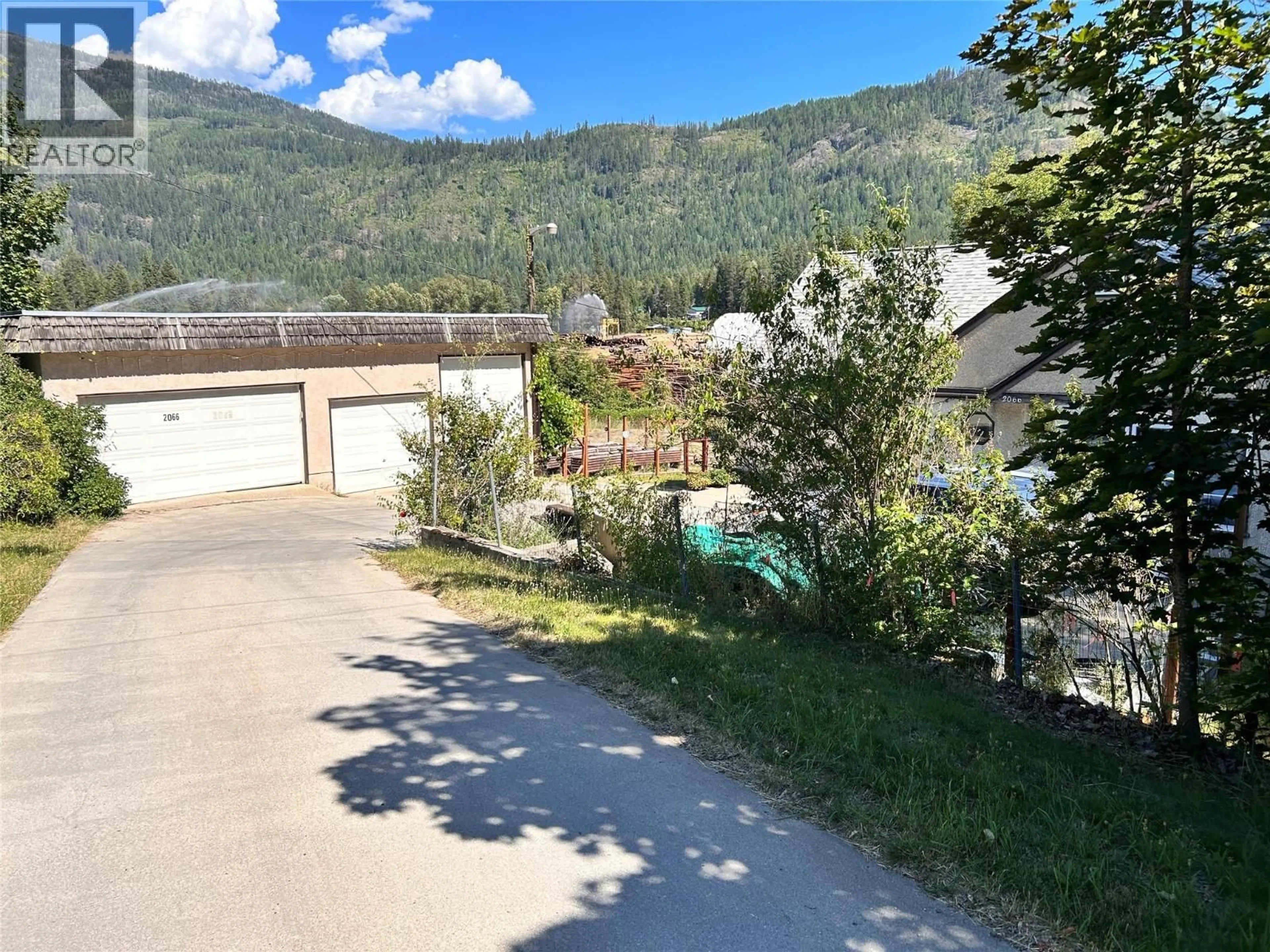 A pic from outside/outdoor area/front of a property/back of a property/a pic from drone, mountain view for 2066 CAUGHLIN ROAD, Fruitvale British Columbia V0G1L1