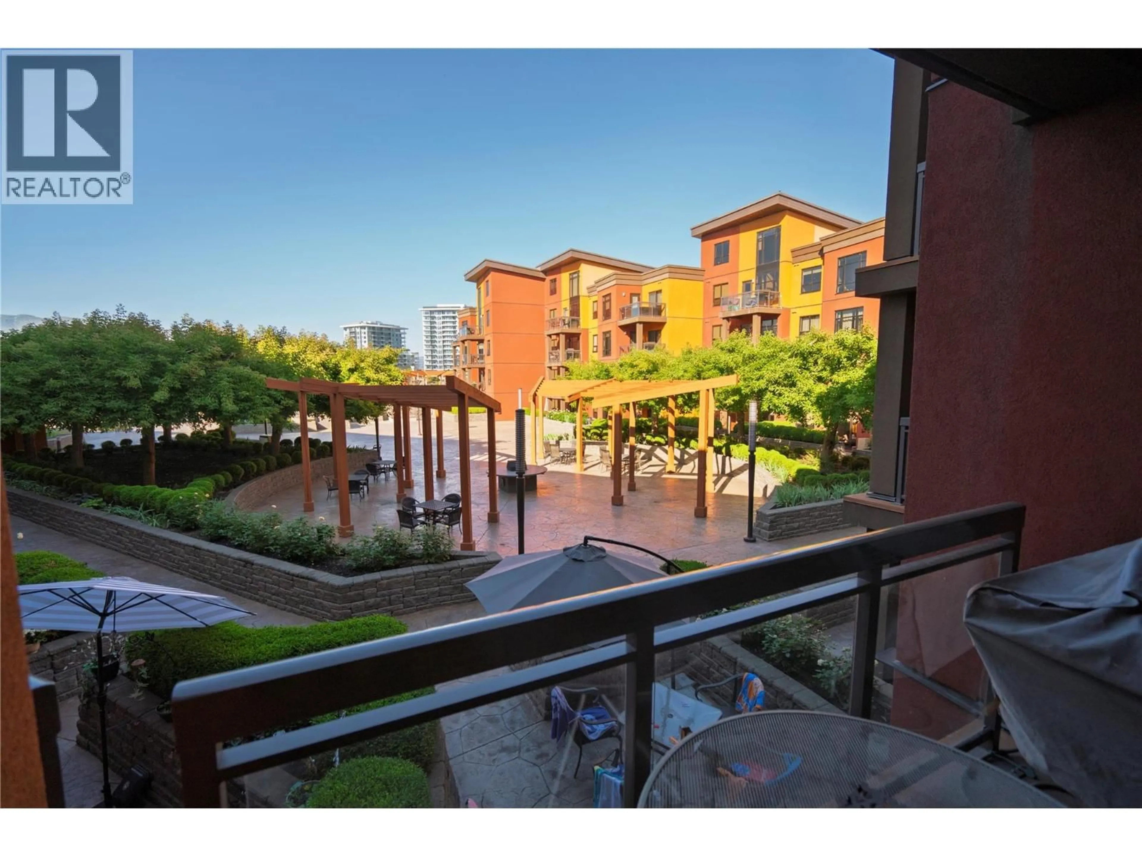 Patio, city buildings view from balcony for 427 - 654 COOK ROAD, Kelowna British Columbia V1W3G7