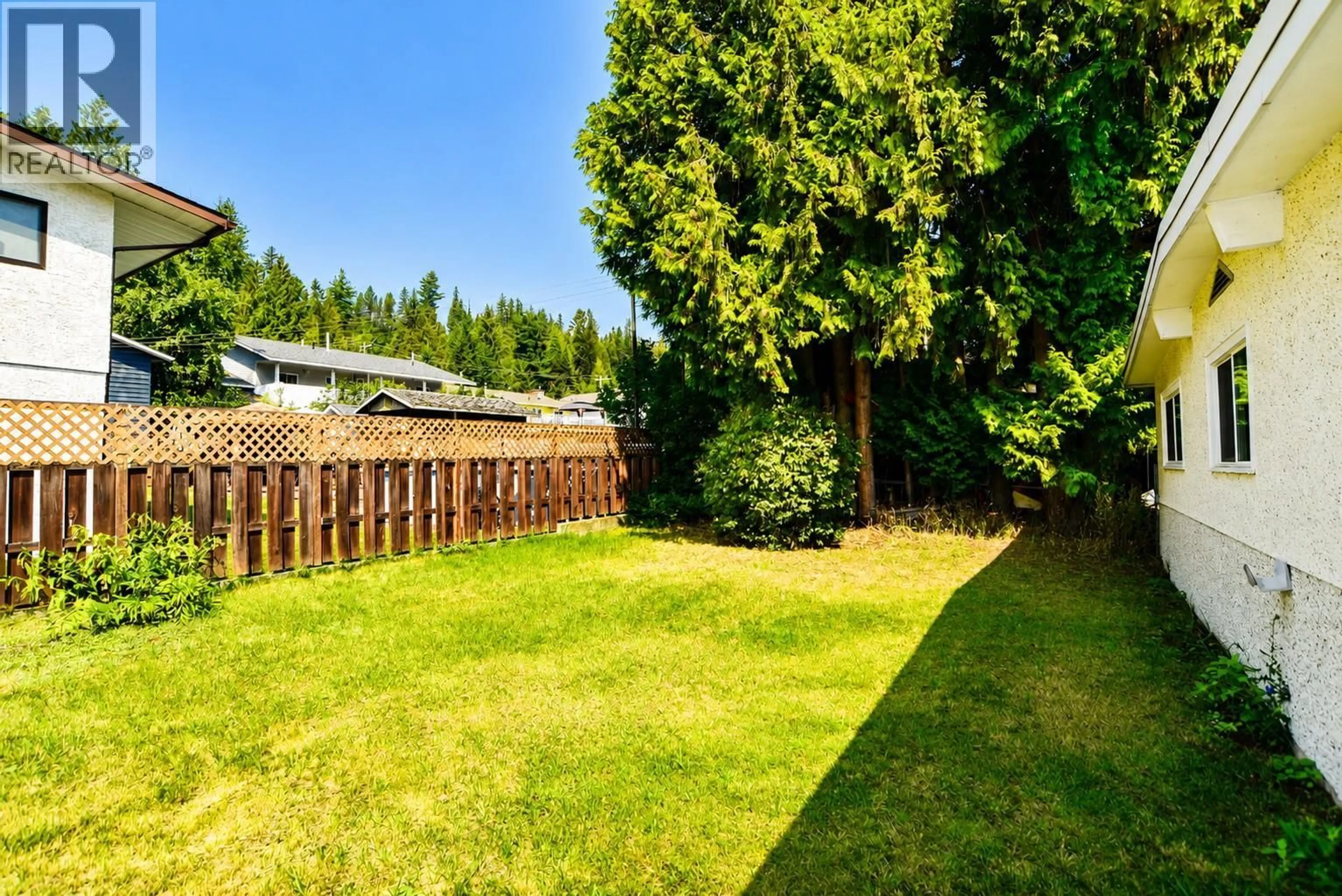 A pic from outside/outdoor area/front of a property/back of a property/a pic from drone, forest/trees view for 2270 10TH AVENUE, Castlegar British Columbia V1N2Z7