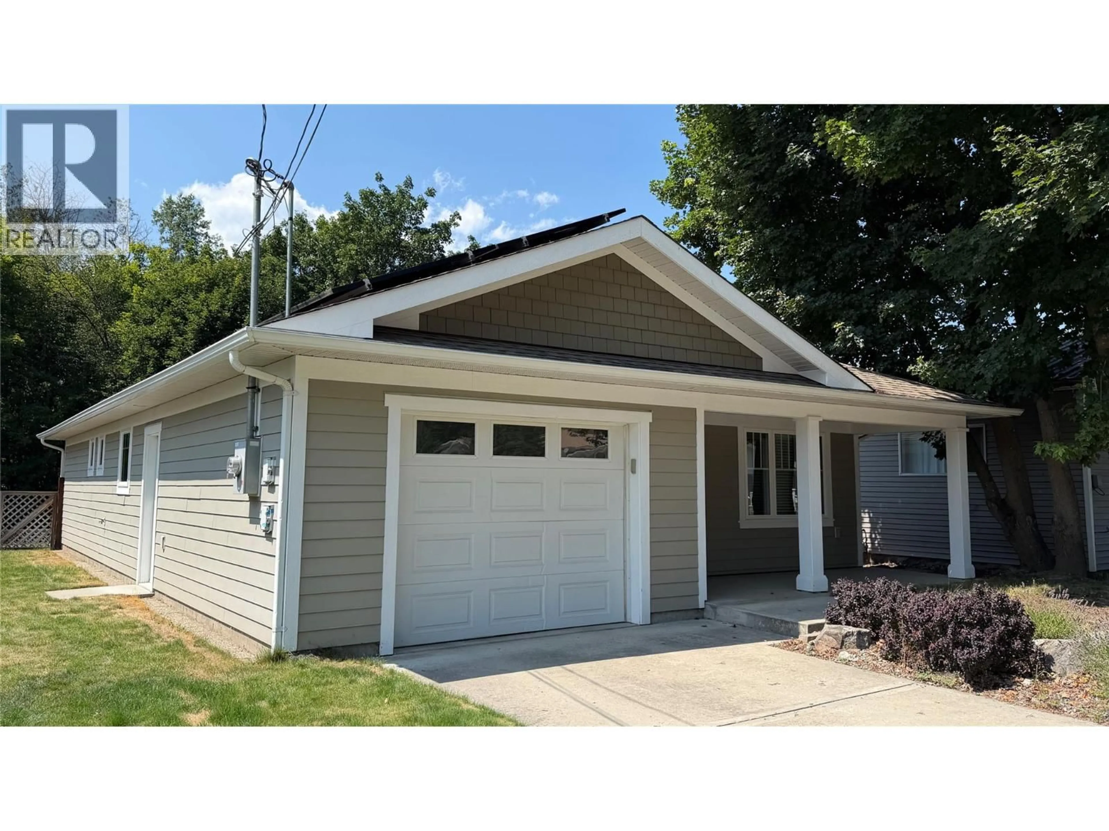 Home with vinyl exterior material, street for 7449 7TH STREET, Grand Forks British Columbia V0H1H0