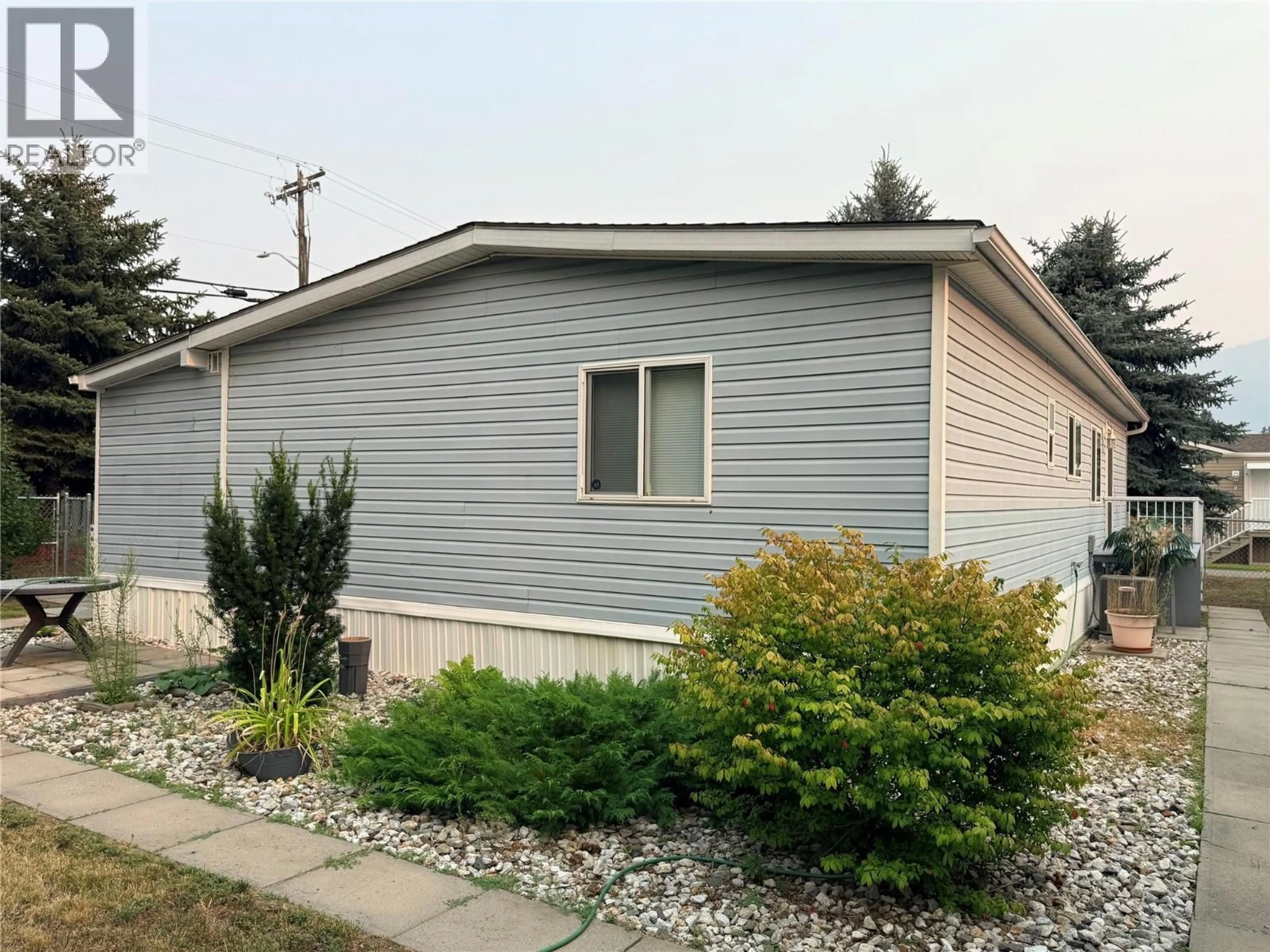 Home with vinyl exterior material, street for 10 - 7225 BOUNDARY DRIVE, Grand Forks British Columbia V0H1H0