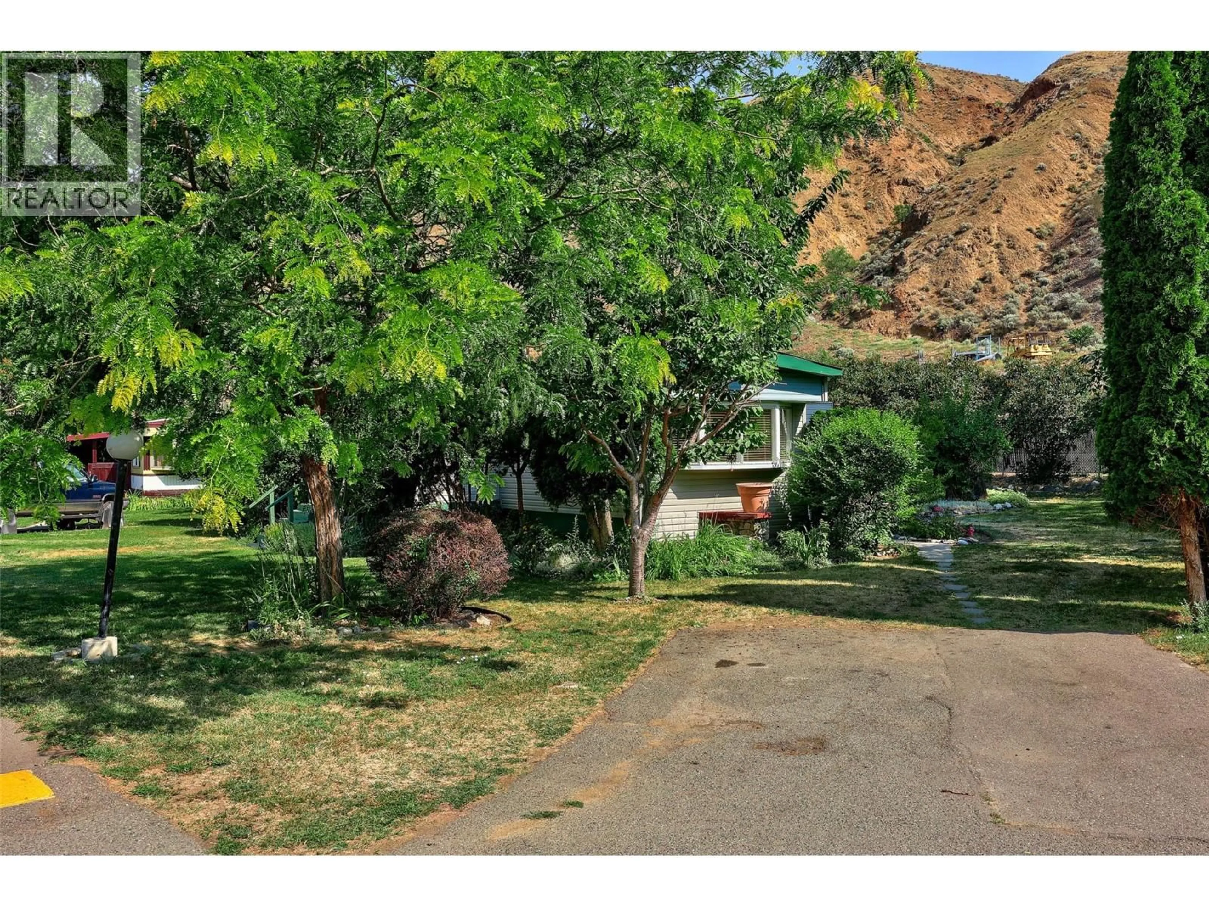 A pic from outside/outdoor area/front of a property/back of a property/a pic from drone, street for 149 - 2401 ORD ROAD, Kamloops British Columbia V2B7V8