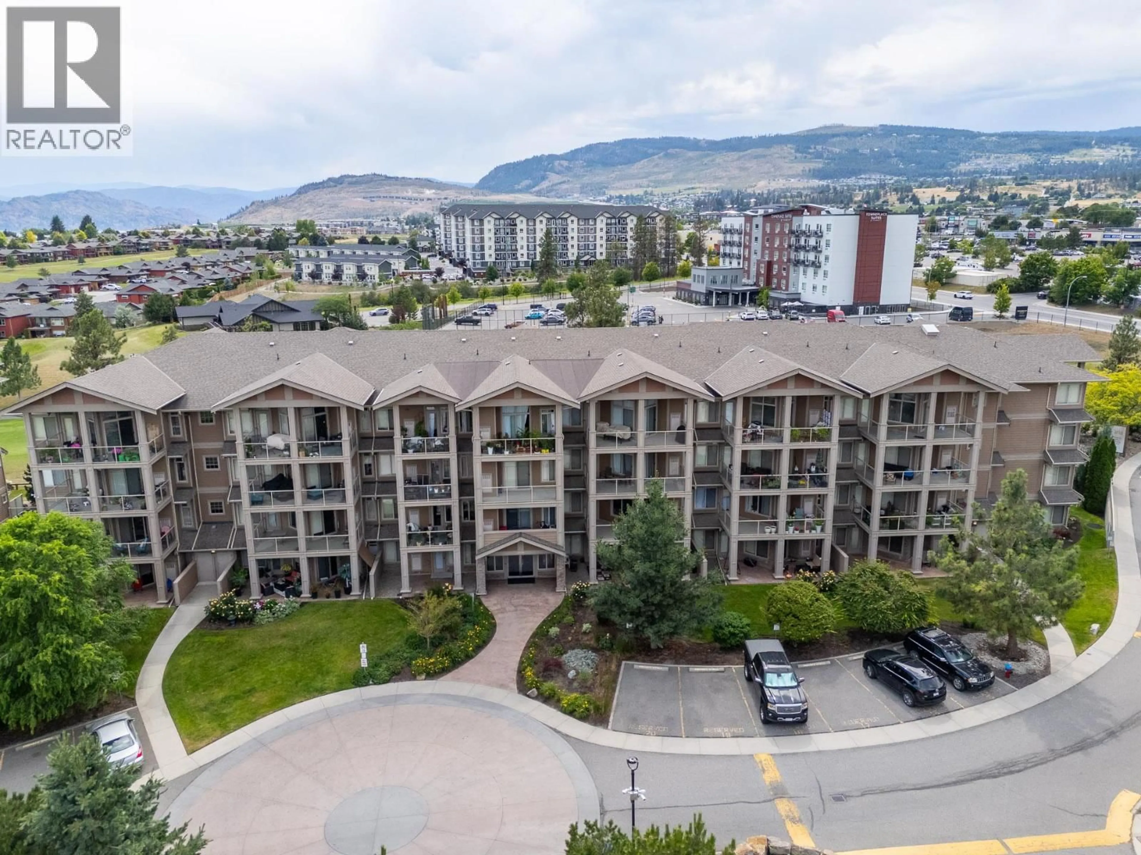 A pic from outside/outdoor area/front of a property/back of a property/a pic from drone, mountain view for 212 - 3533 CARRINGTON ROAD, West Kelowna British Columbia V4T2Z9